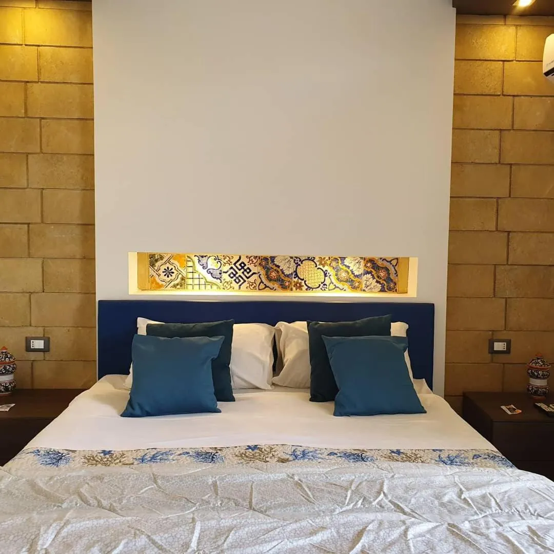 Bed in Mongibello Palace B&B