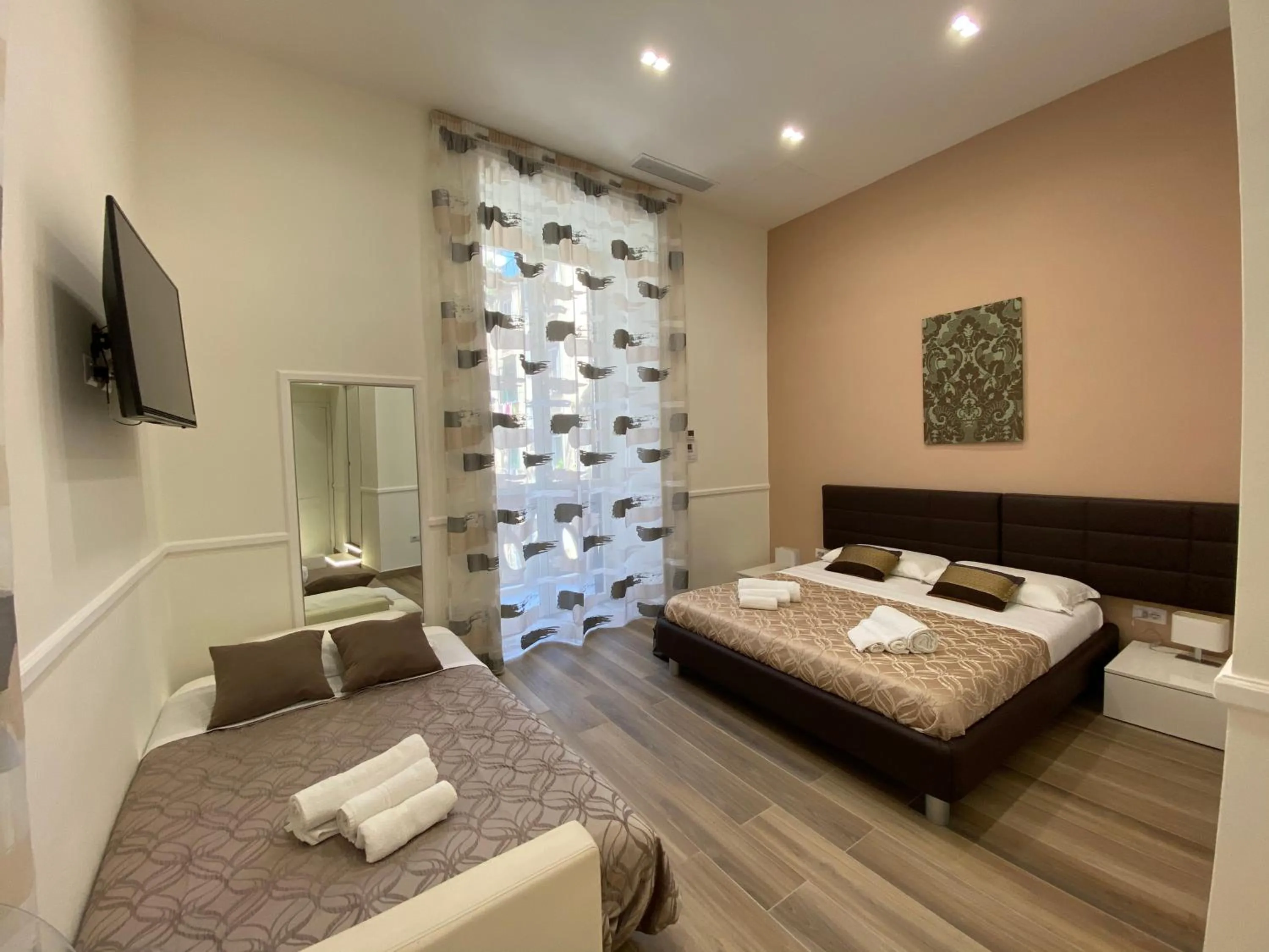 Bed in Sun Art Naples Rooms