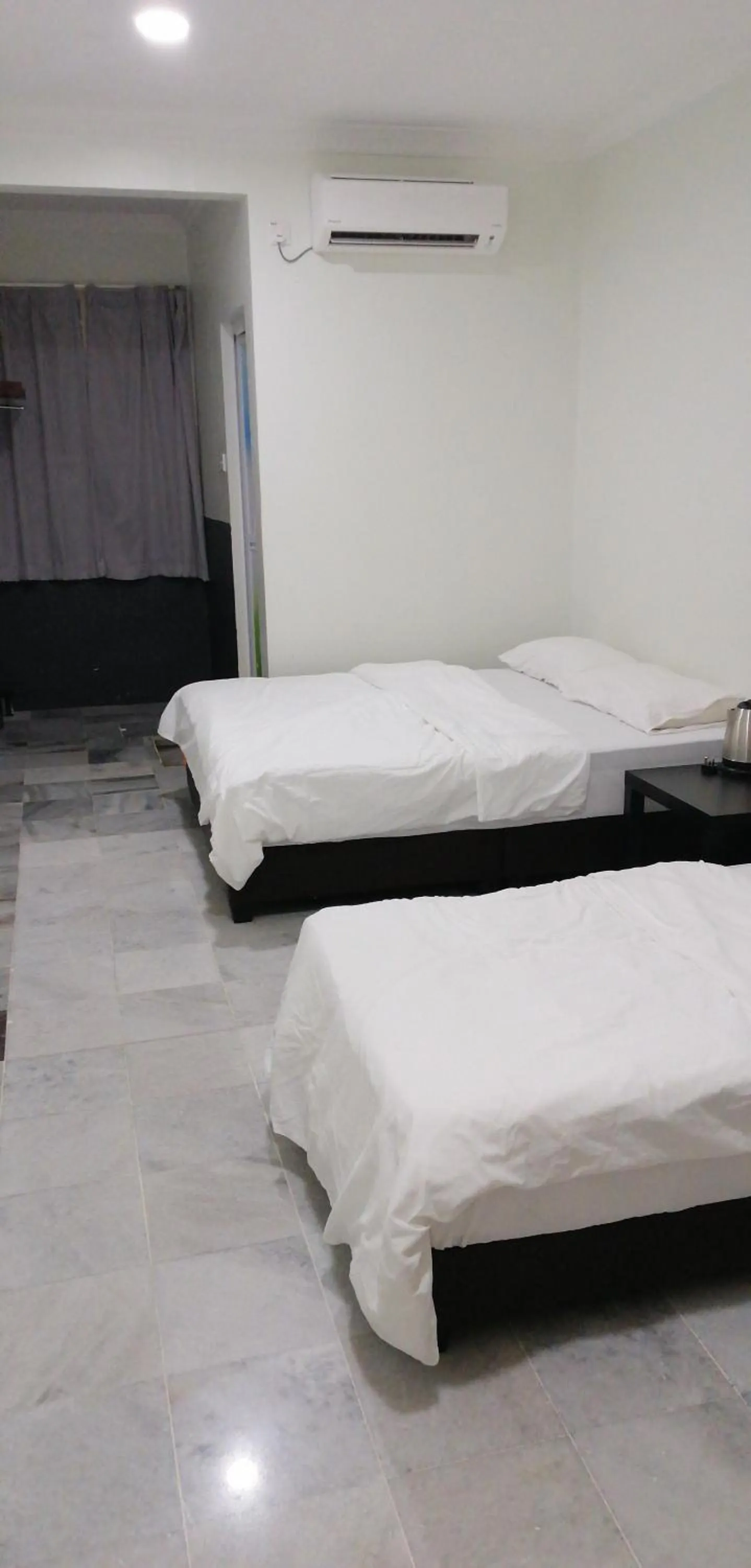 Bed in JS Guest House Air Putih