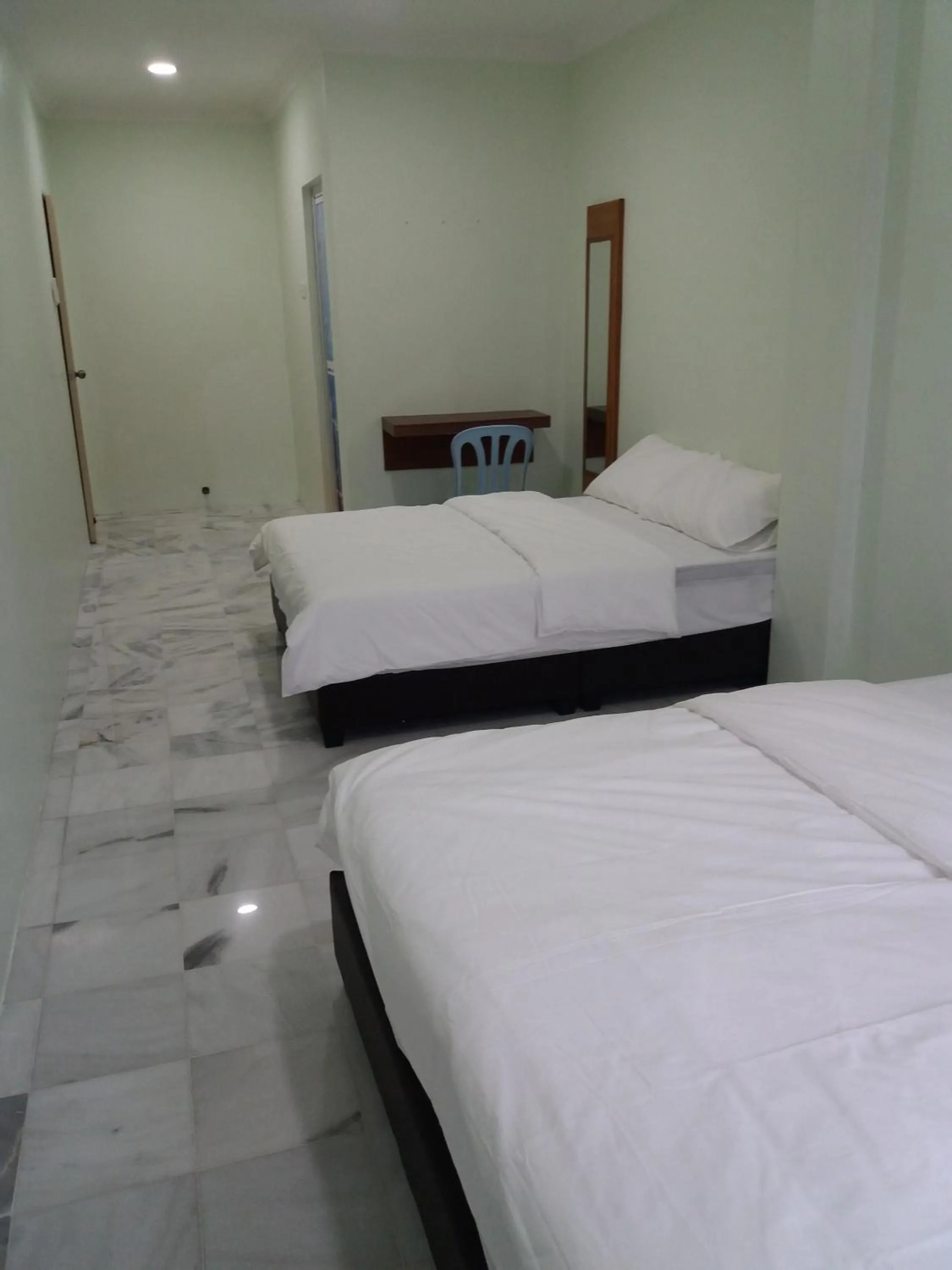 Bed in JS Guest House Air Putih