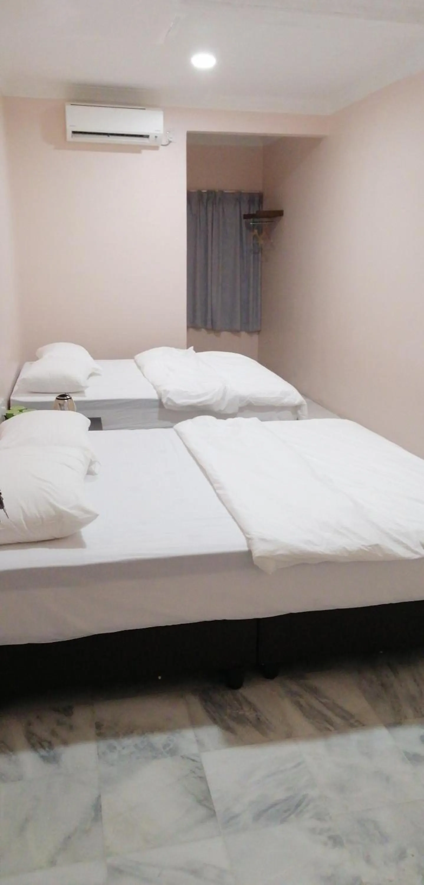 Bed in JS Guest House Air Putih