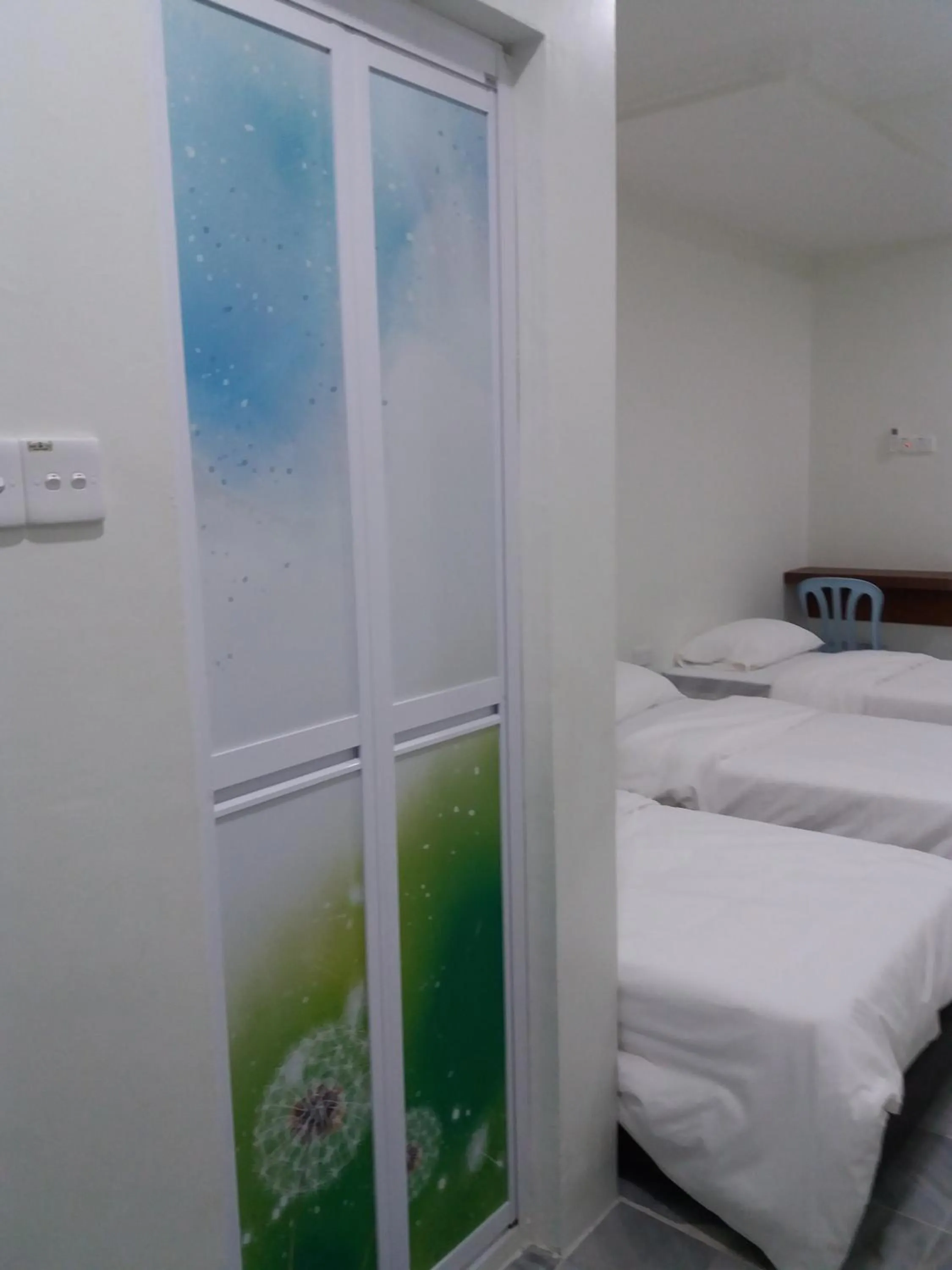 Bed in JS Guest House Air Putih