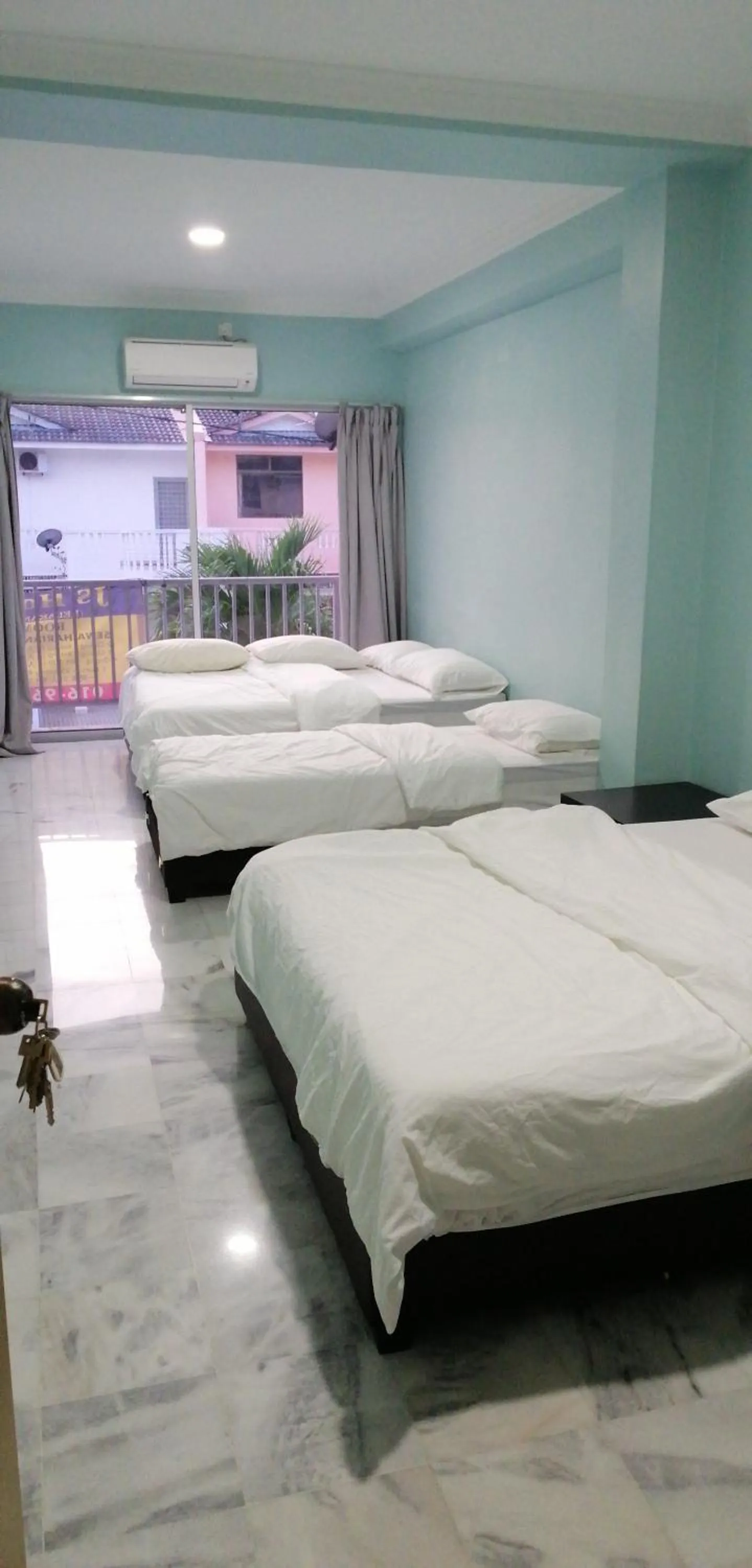 Bed in JS Guest House Air Putih