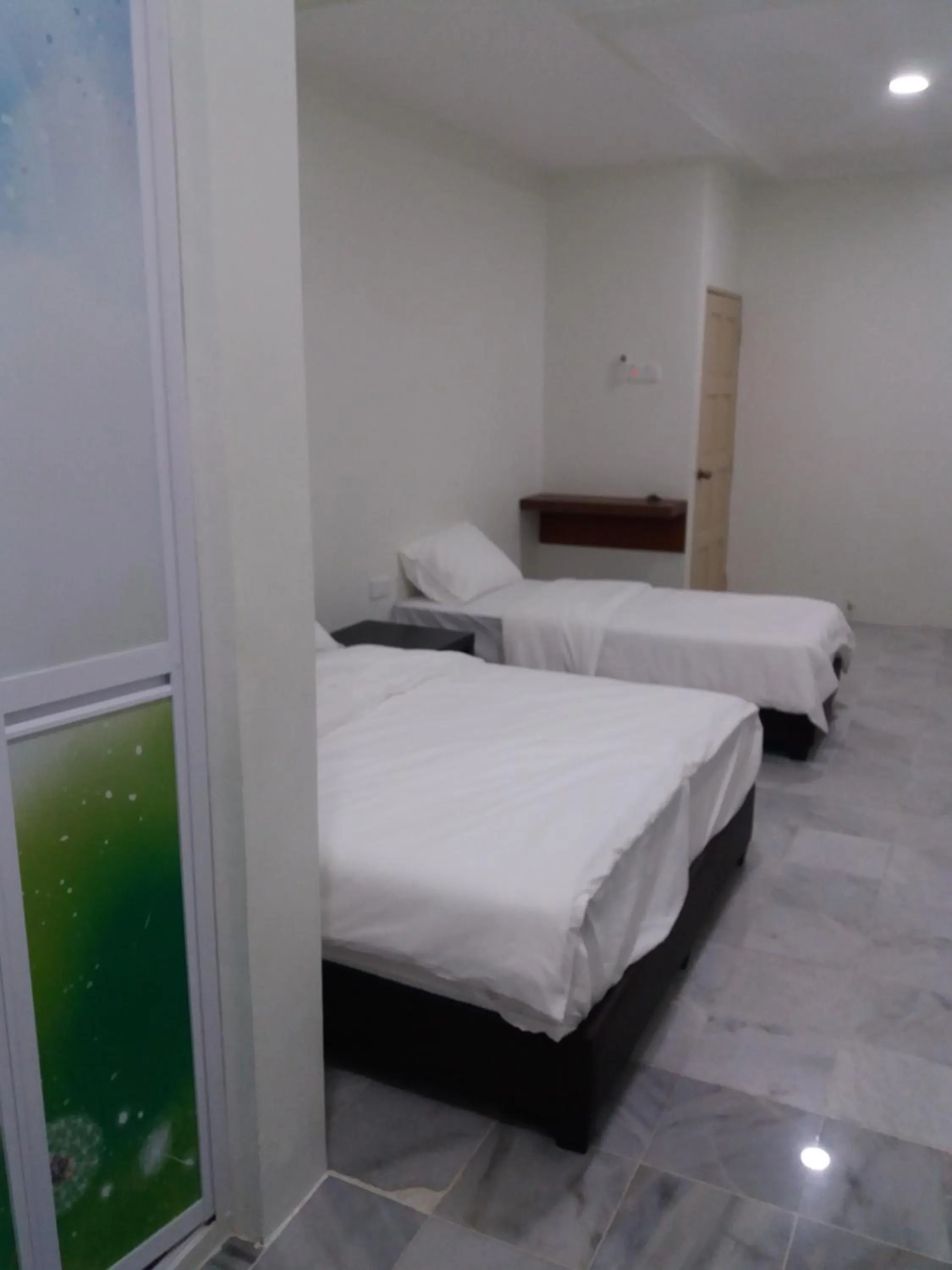 Bed in JS Guest House Air Putih