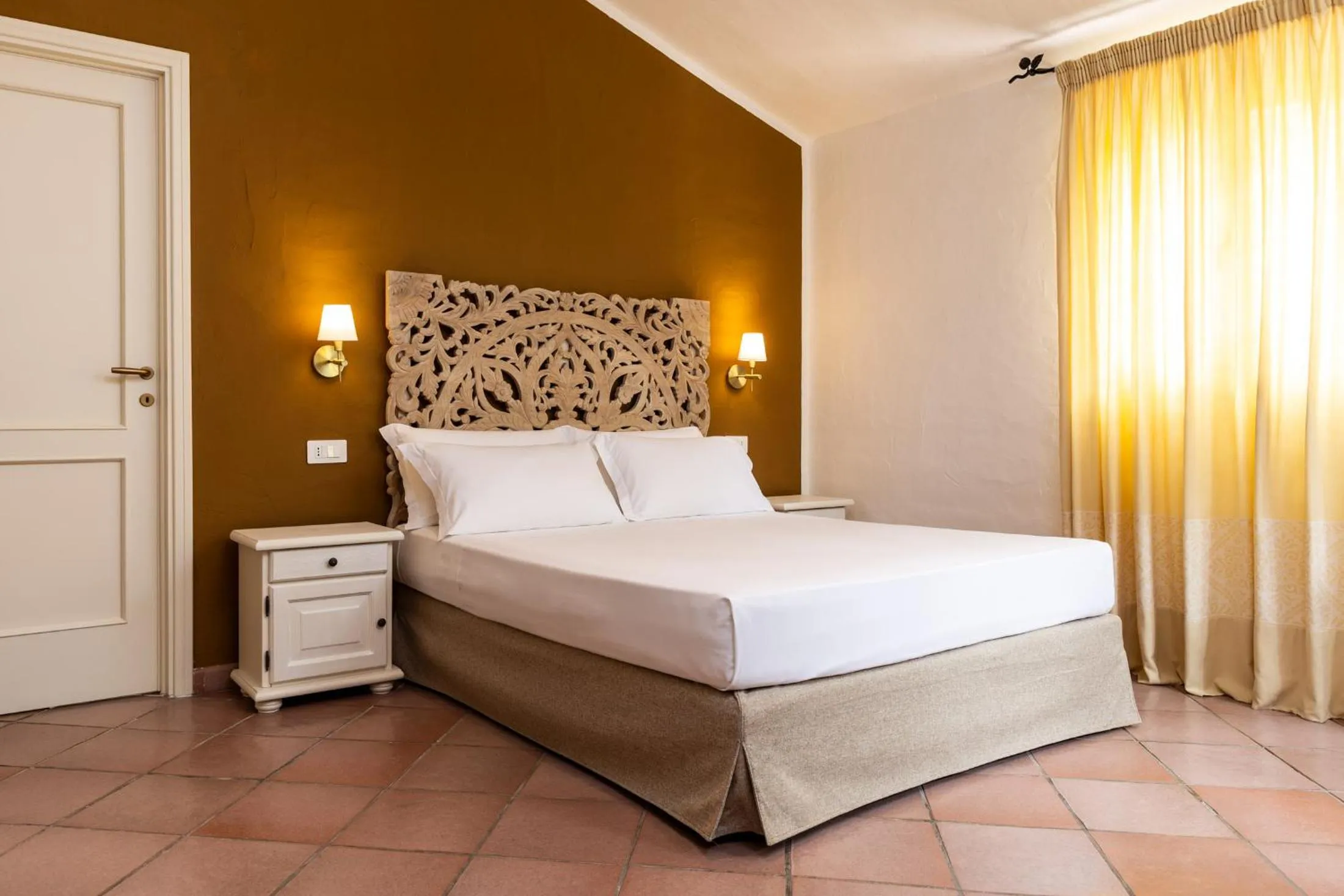 Bed in La Jacia Hotel & Resort