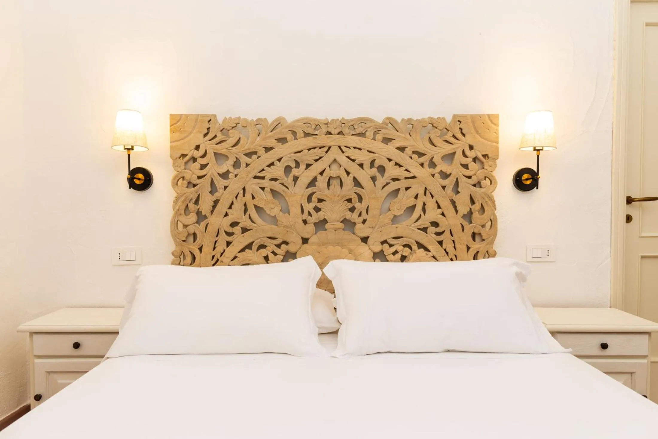 Bed in La Jacia Hotel & Resort