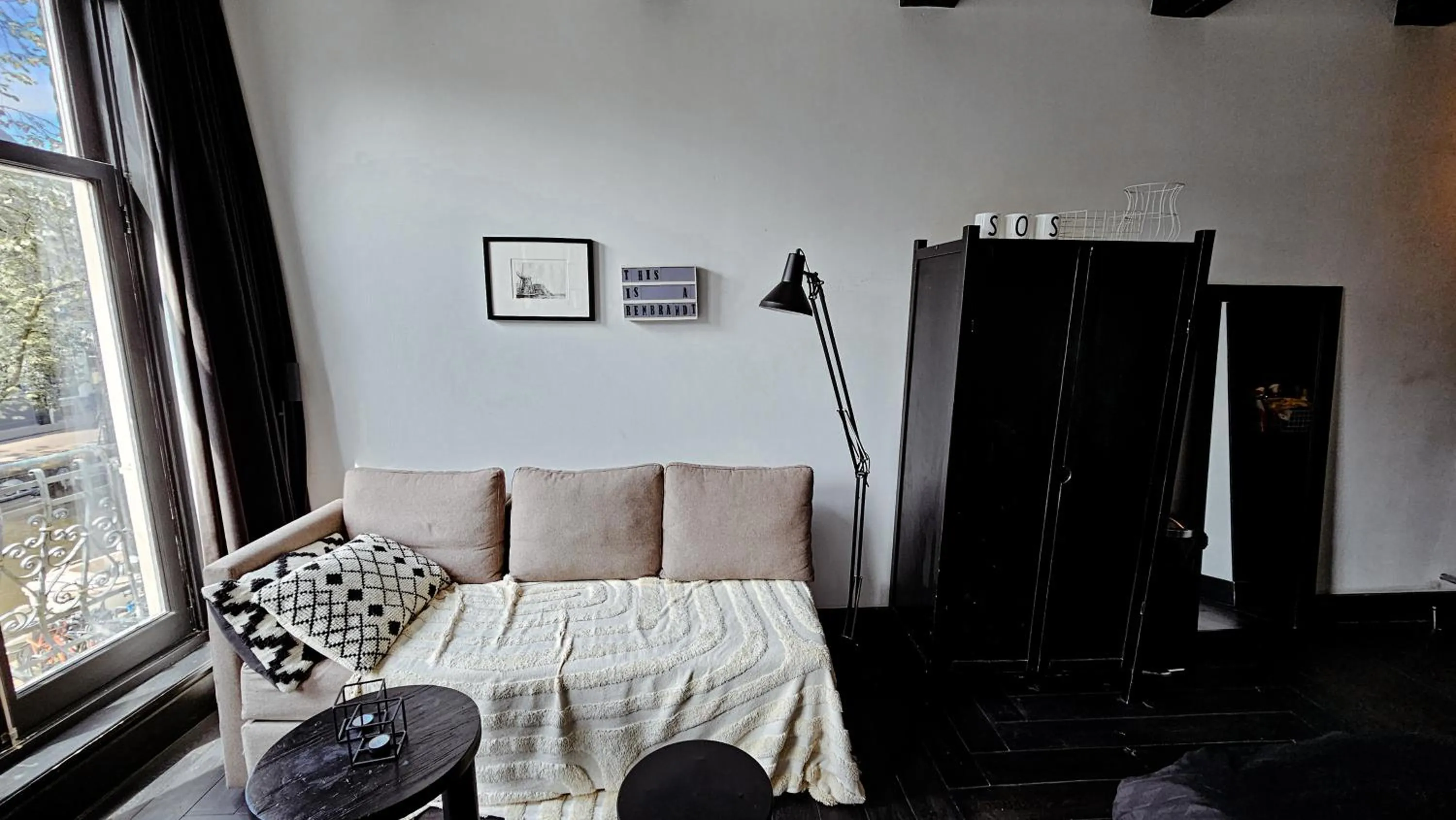 Seating area, Bed in JoyJoyJoy the Black Beauty ecolicious studio in a canal house with French balcony with view on the canals