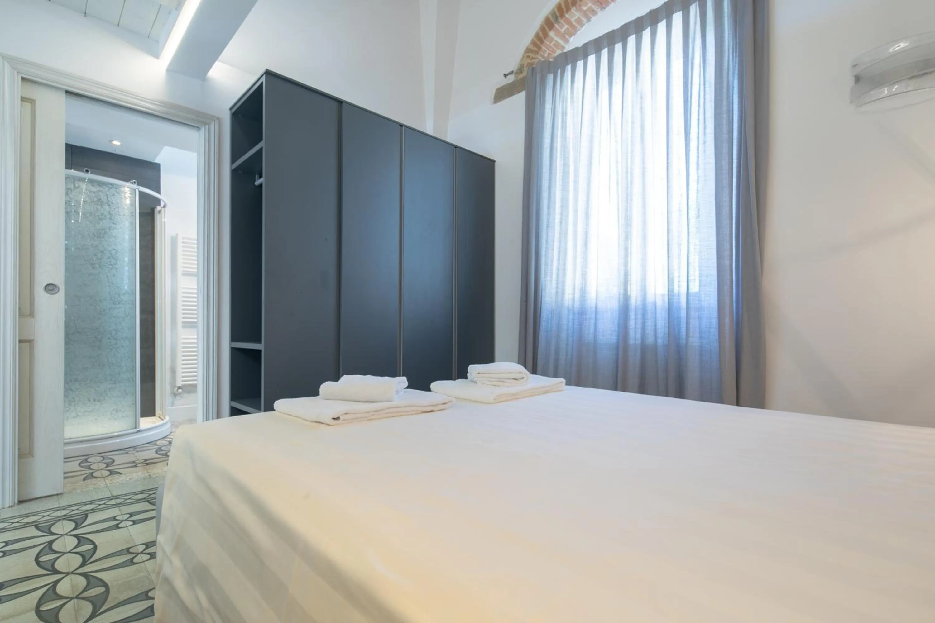 Bed in Giglio Apartments by Mmega