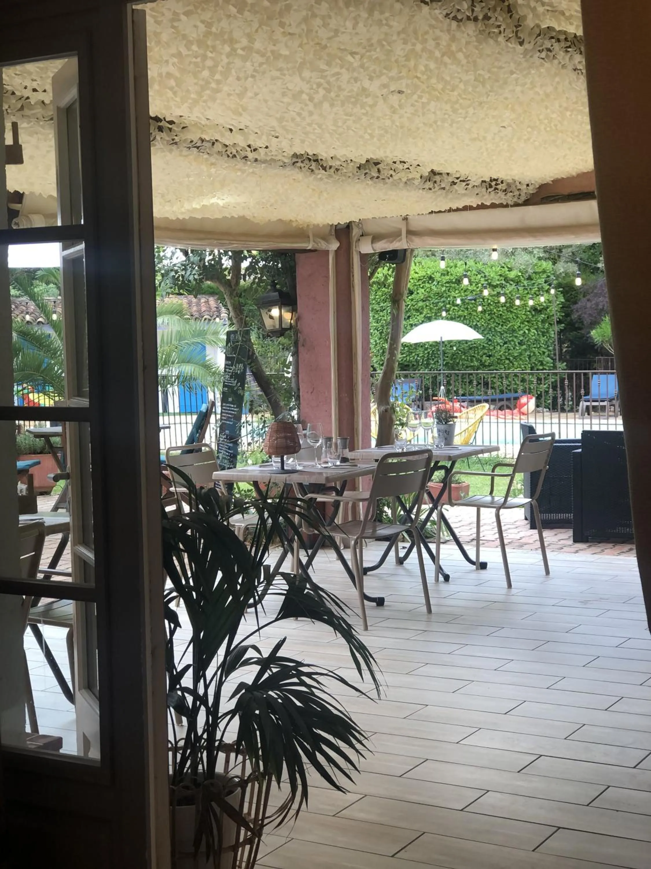 Patio in Logis Hôtels La Bastide des Golfs