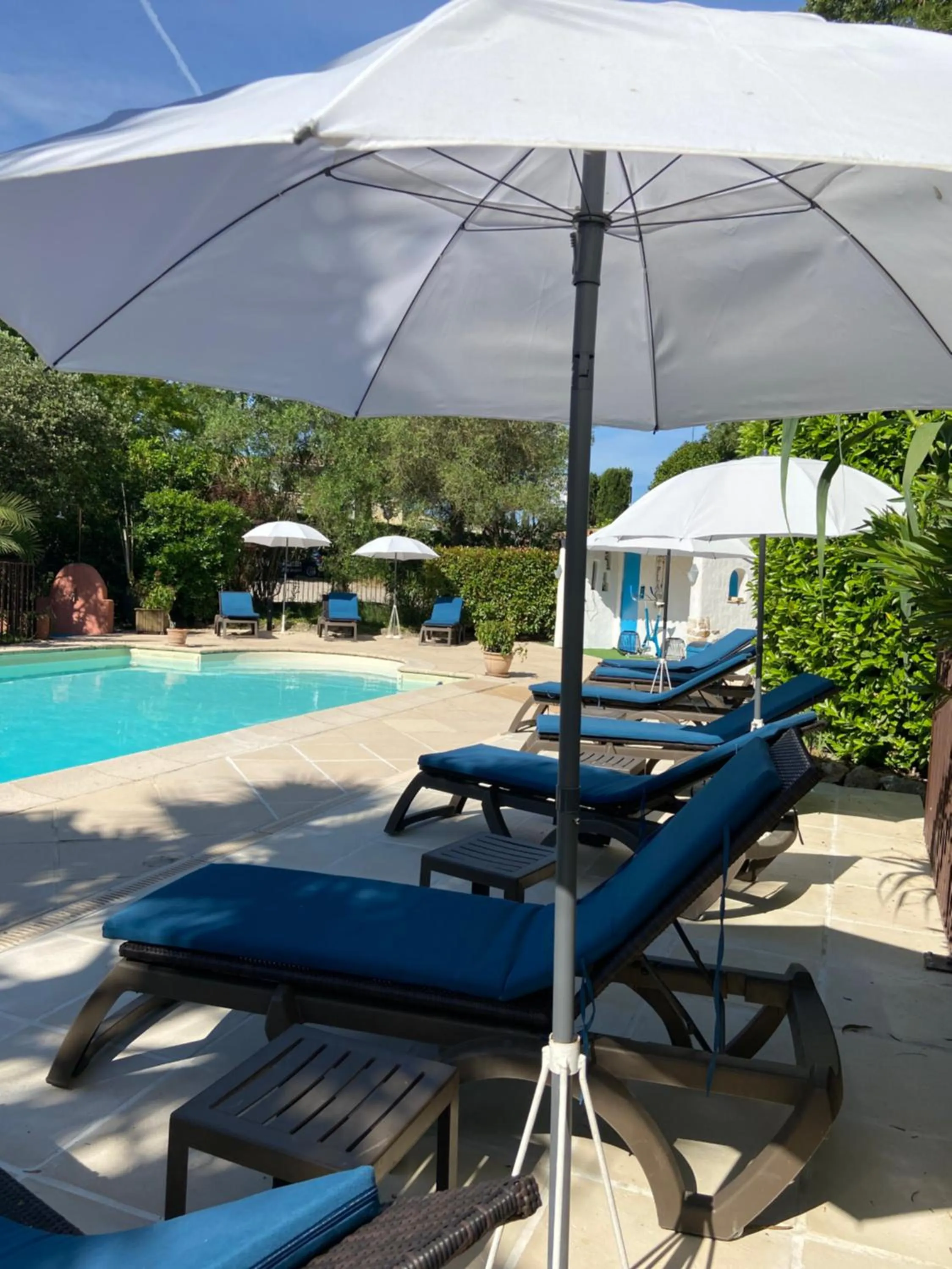 Swimming pool in Logis Hôtels La Bastide des Golfs