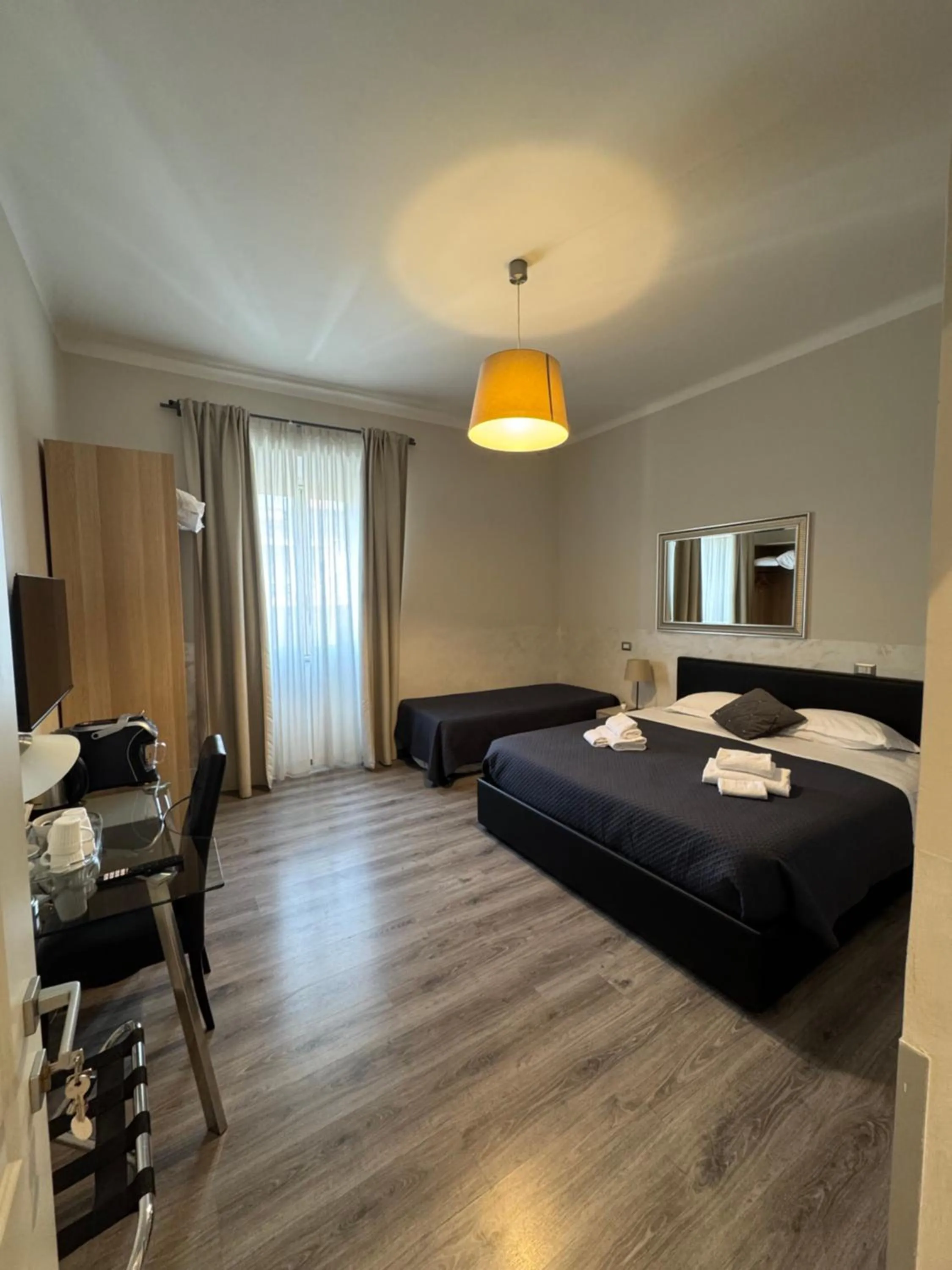 Bed in RHS Rienzo Suites