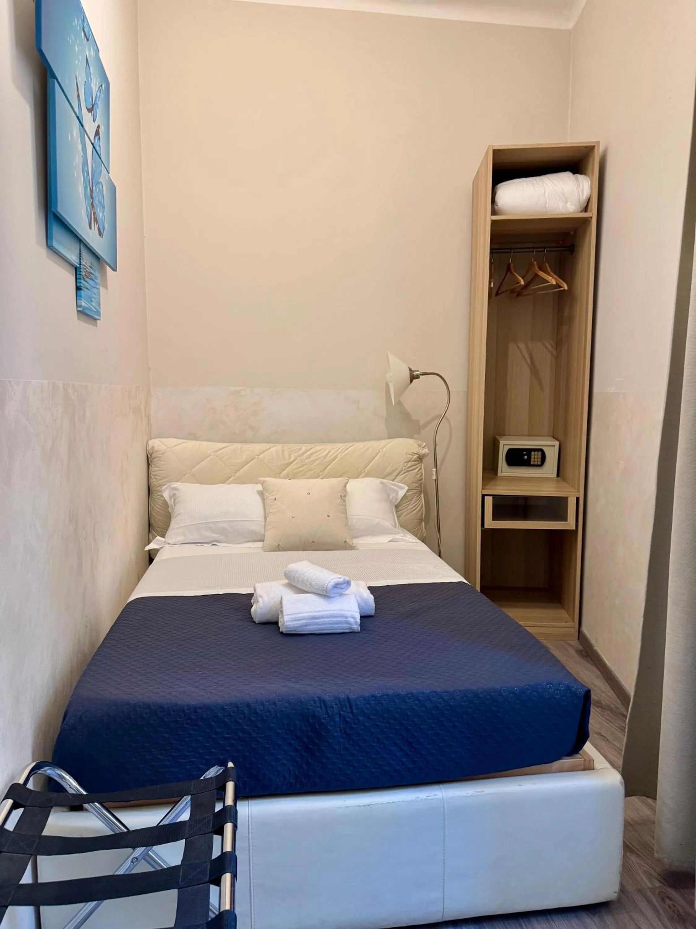 Bed in RHS Rienzo Suites