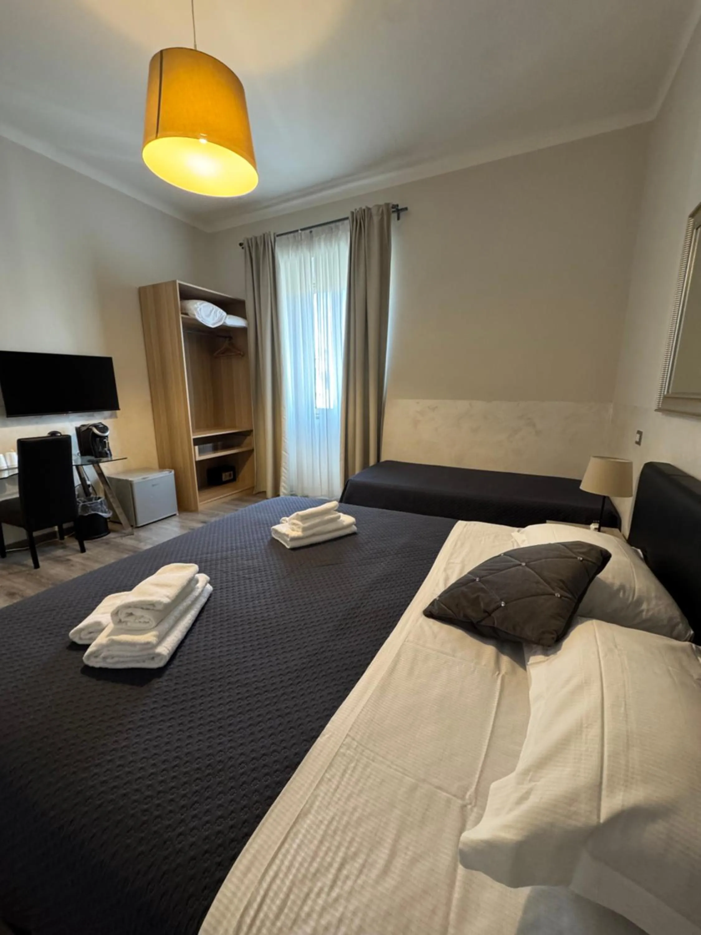 Bed in RHS Rienzo Suites