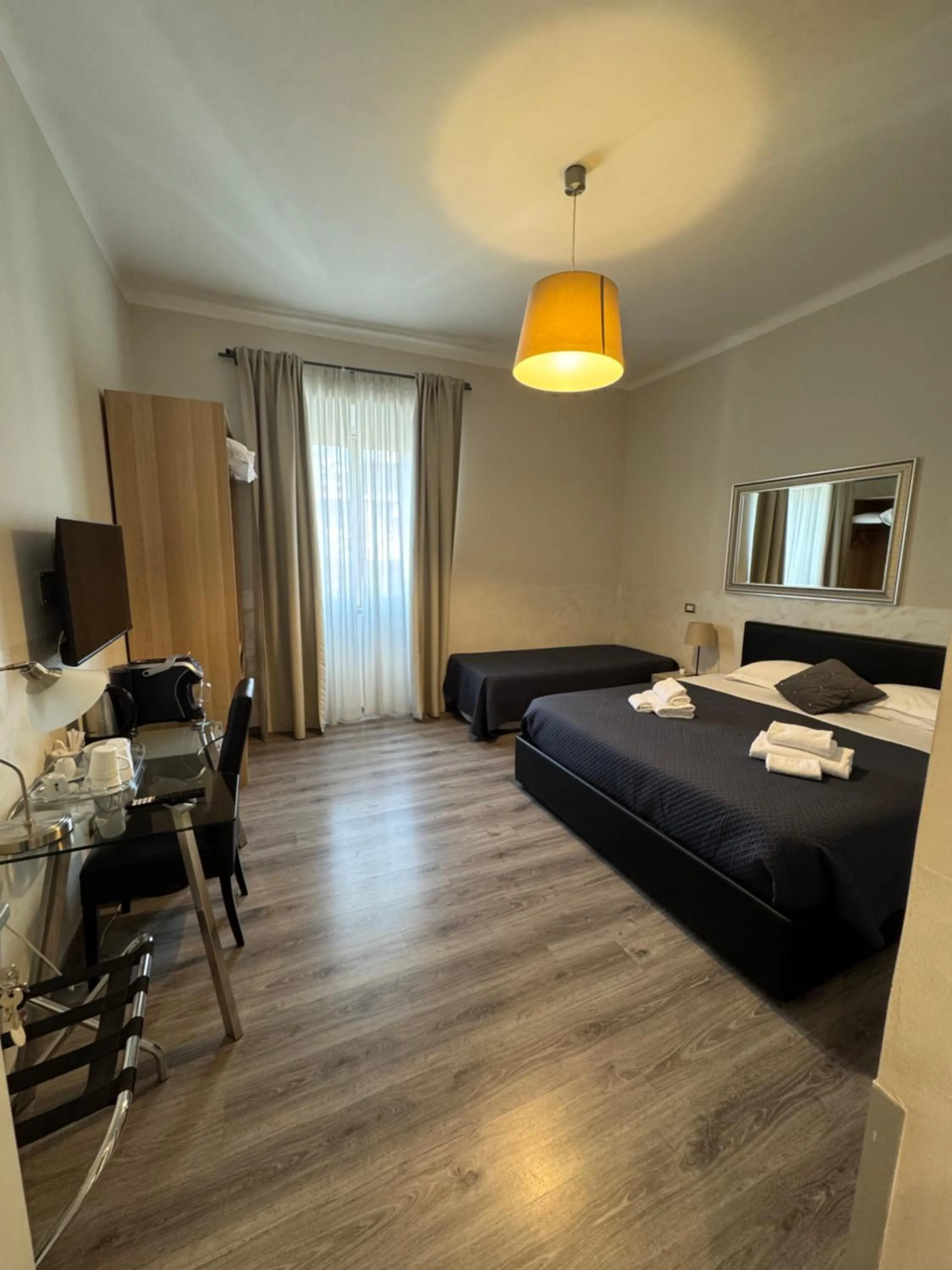 Bed in RHS Rienzo Suites