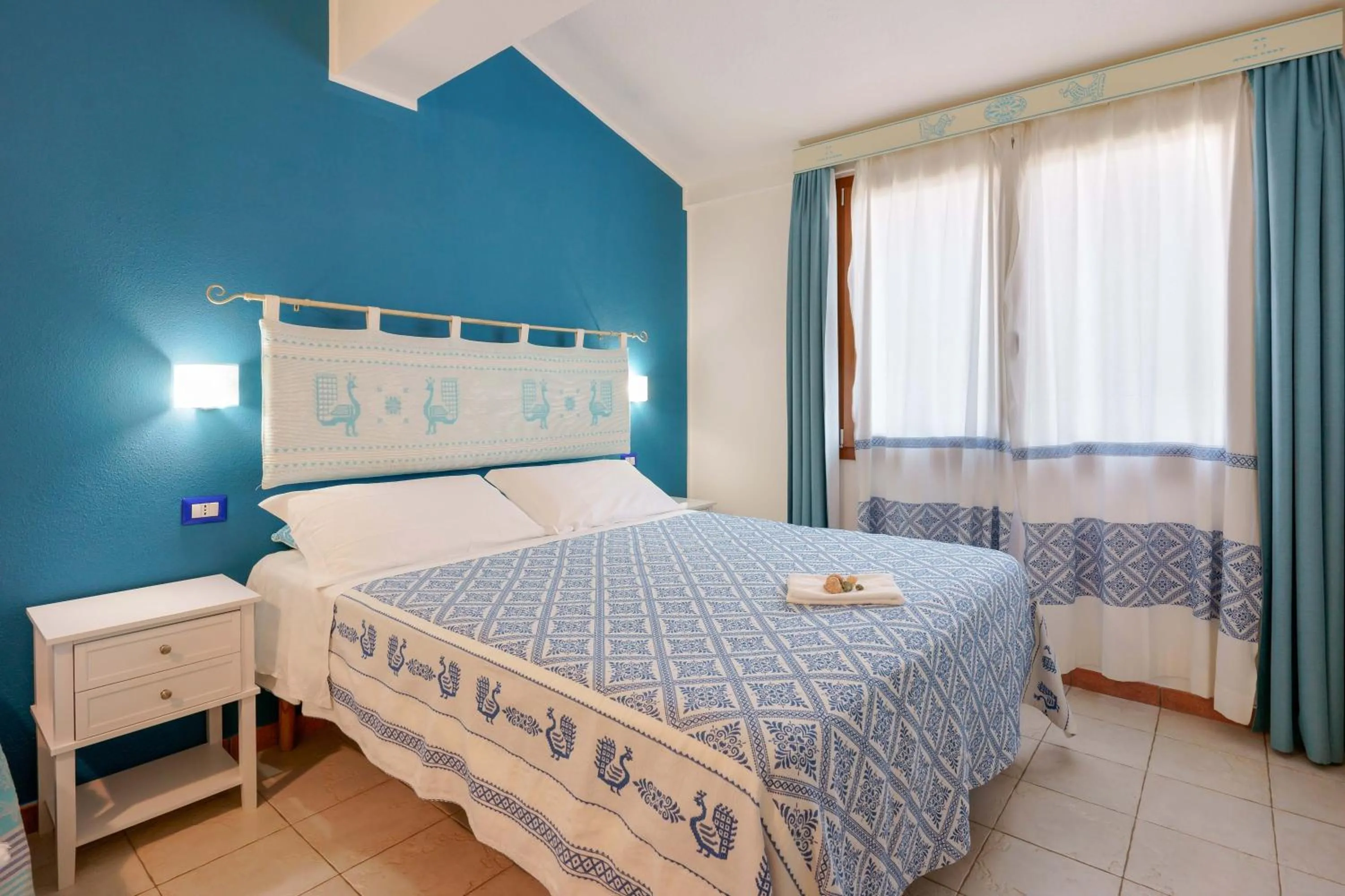 Bedroom in Il Piccolo Giardino rooms & breakfast