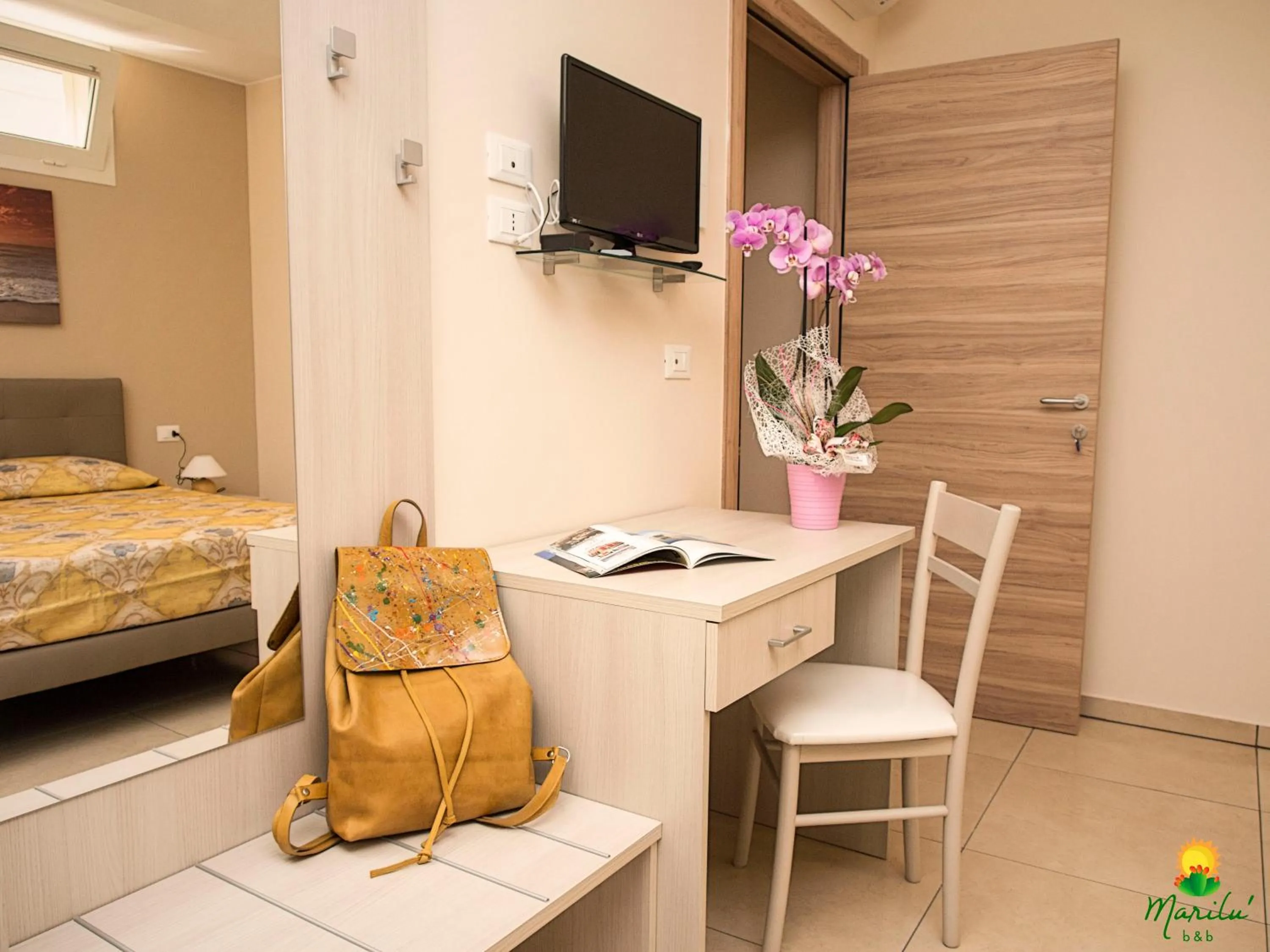 Seating area, Bed in Marilù B&B