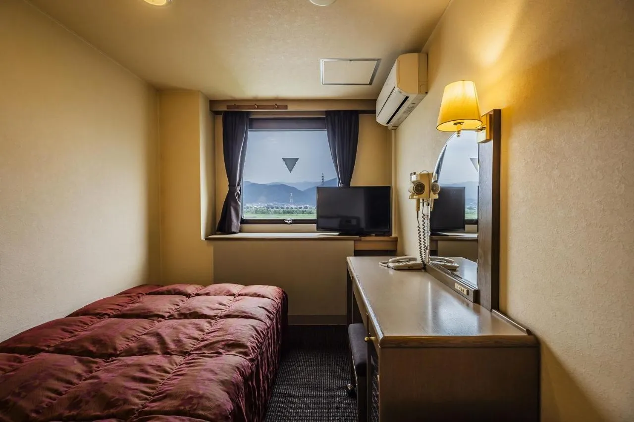 Bed in Asahi Century Hotel