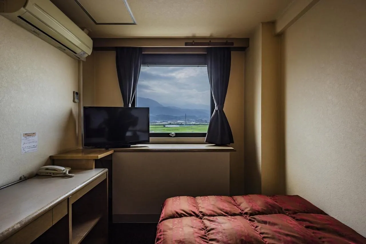 Bed in Asahi Century Hotel