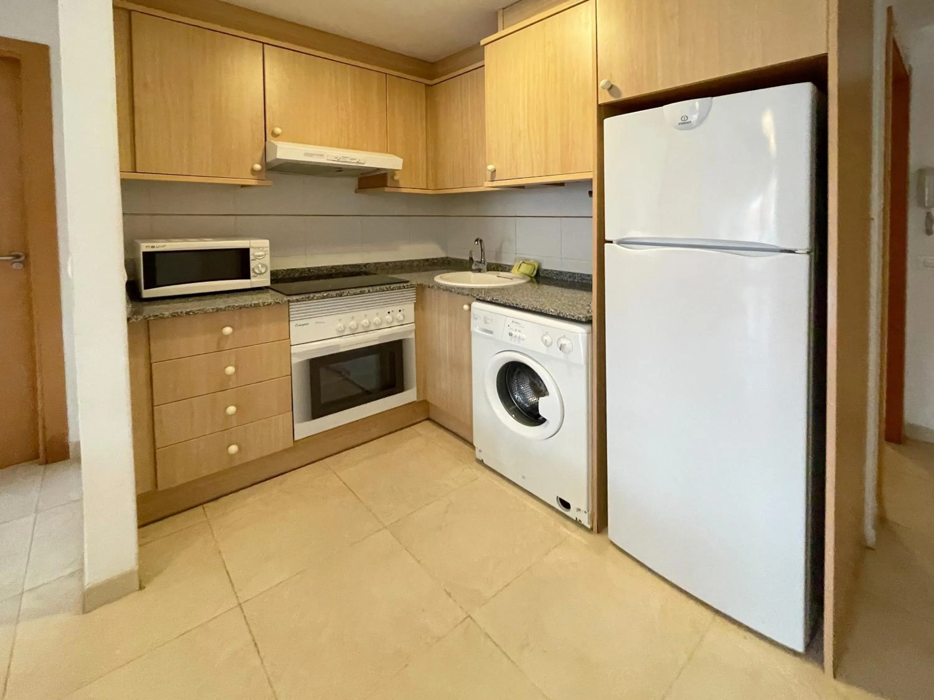 Kitchen or kitchenette in Apartamentos Los Almendros 3000