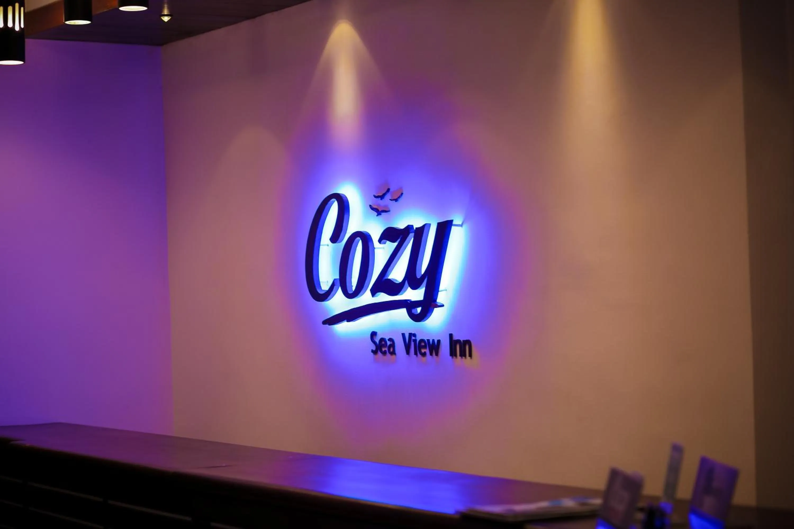 Property logo or sign in Cozy Sea view Inn