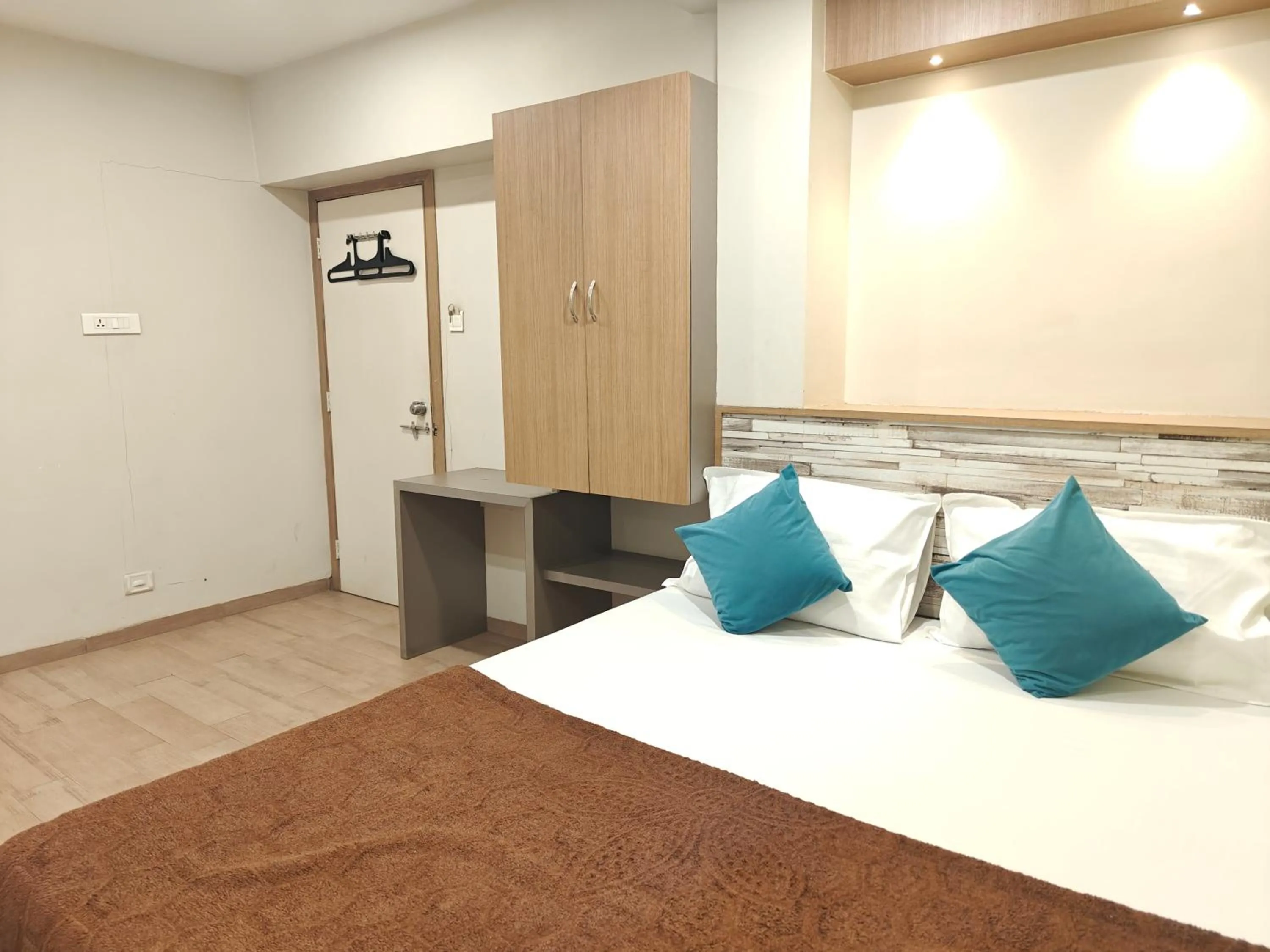 Bed in Central Inn, Kolhapur