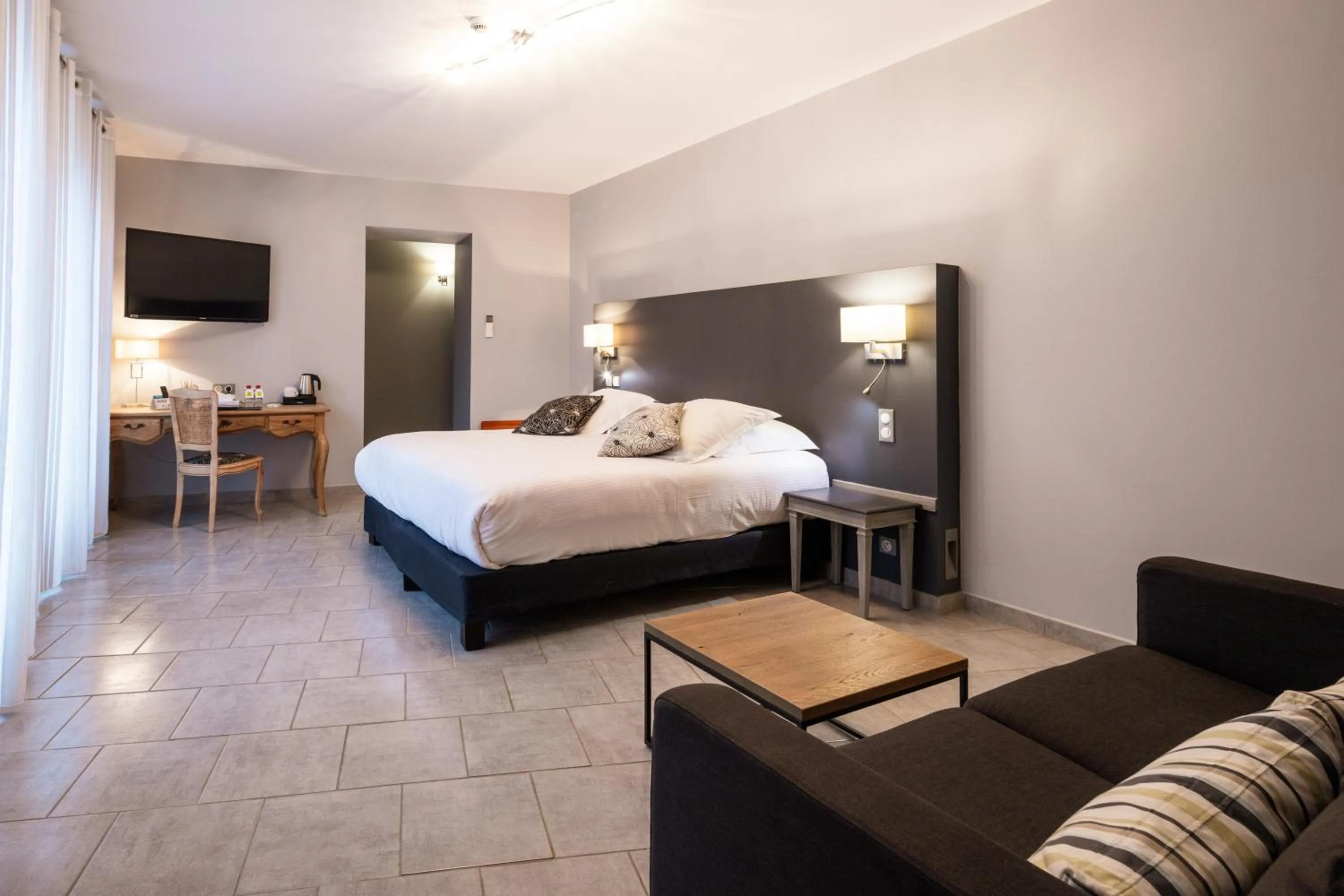 Photo of the whole room, Bed in Logis Hôtel Restaurant de la Paix