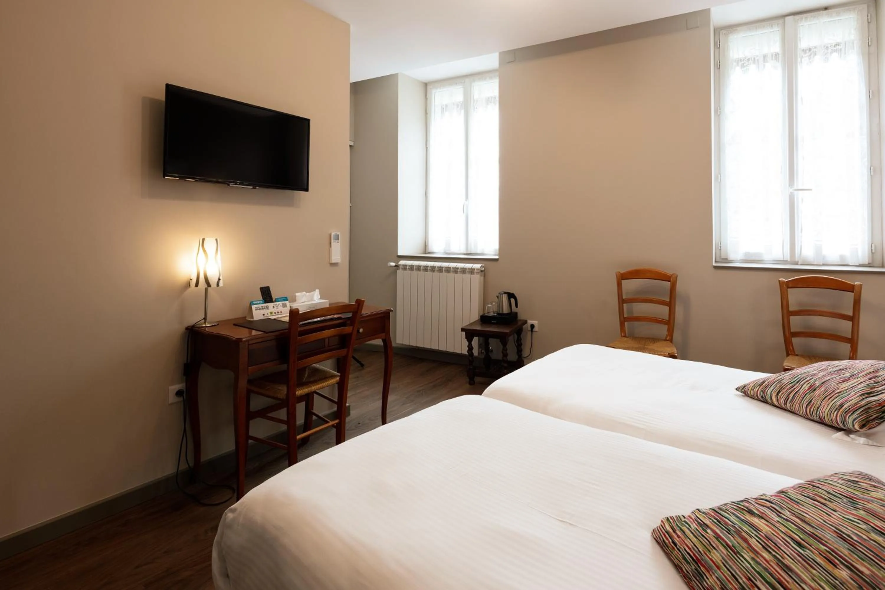 Photo of the whole room, Bed in Logis Hôtel Restaurant de la Paix