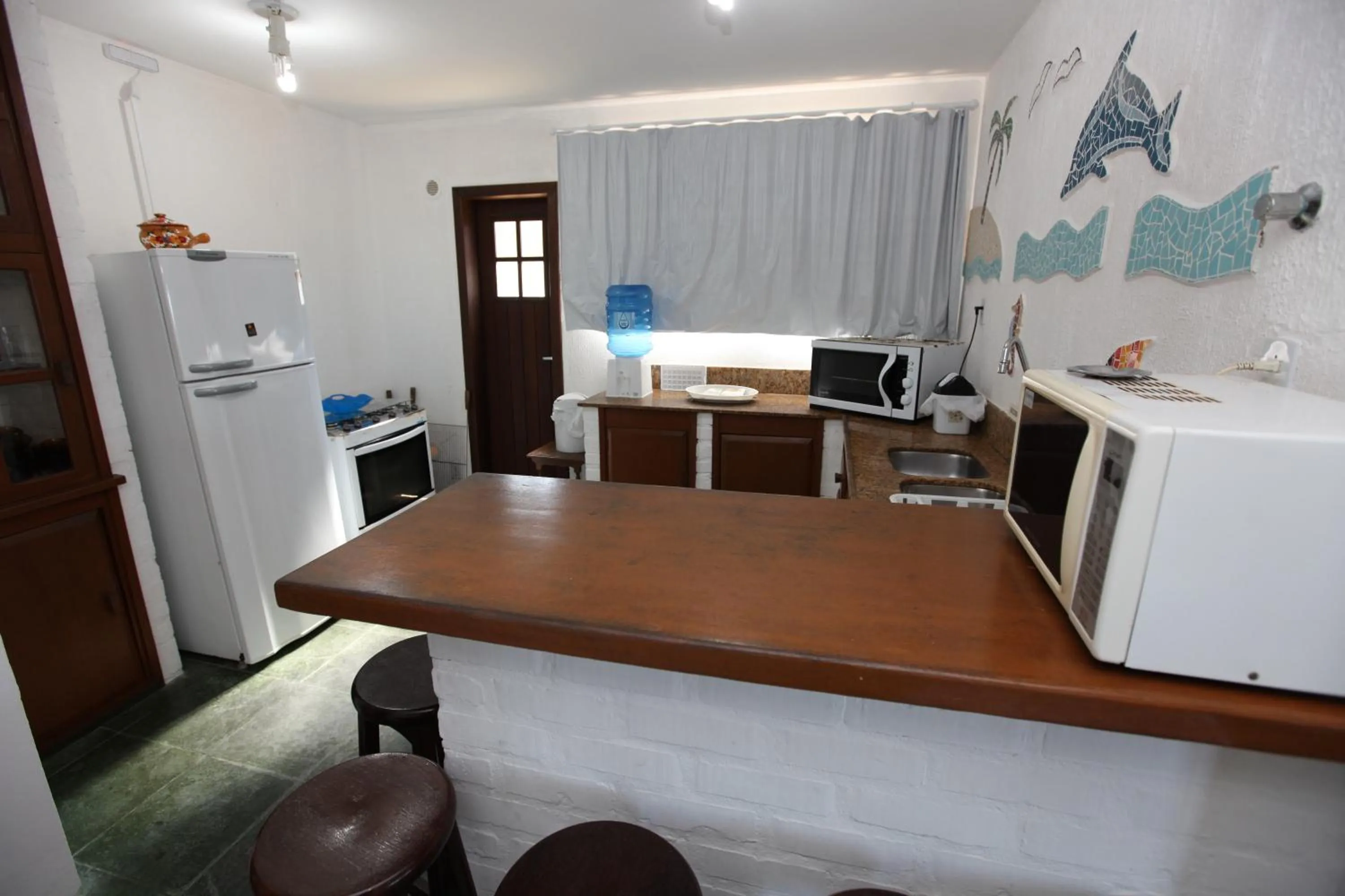 Kitchen or kitchenette in Pousada Hibisco