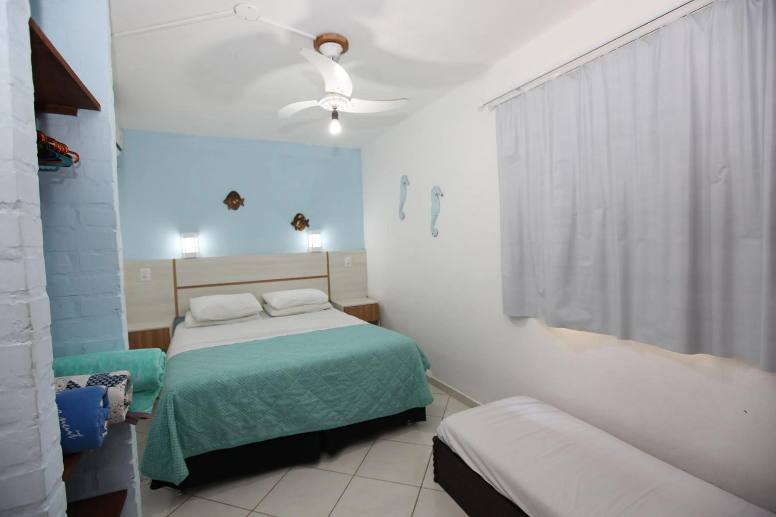 Photo of the whole room, Bed in Pousada Hibisco