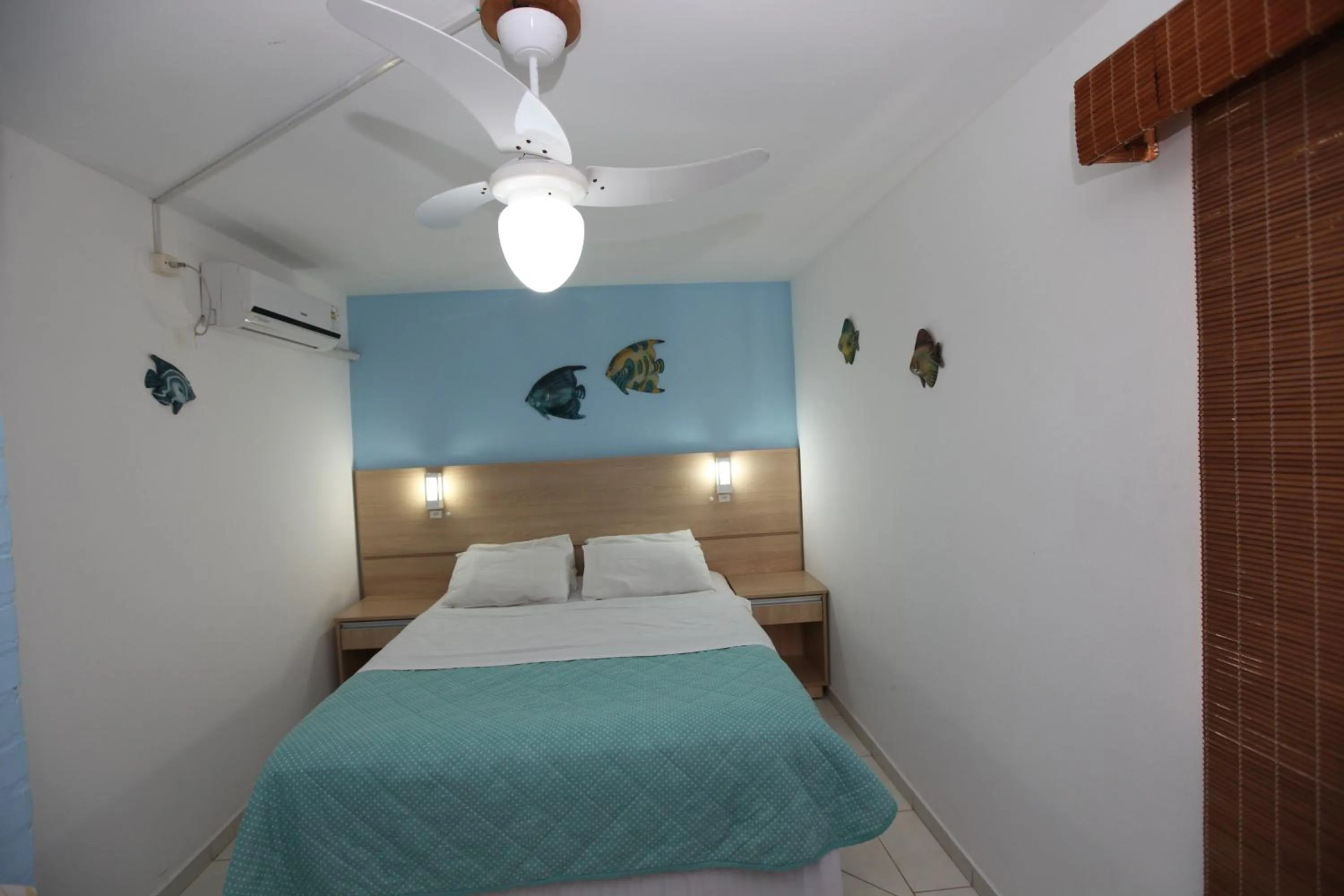 Bed in Pousada Hibisco