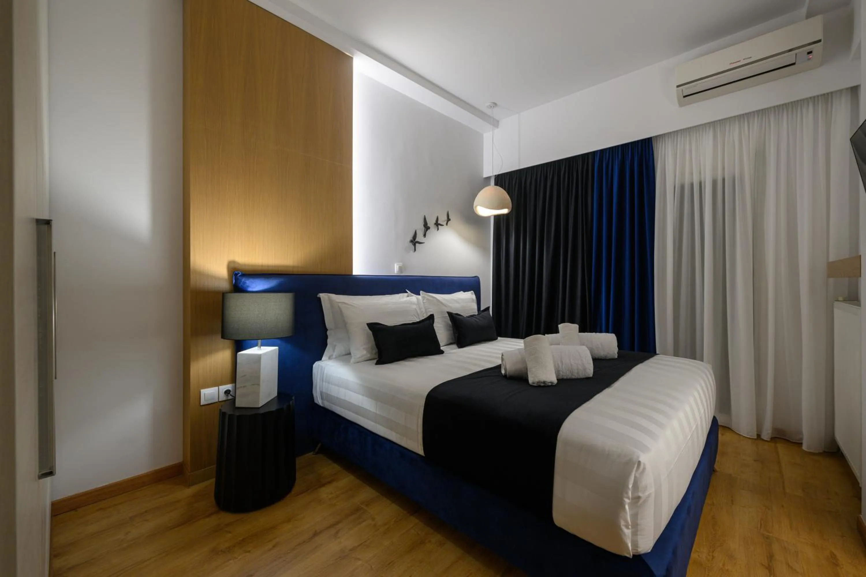 Bed in Acropolis View Deluxe Penthouse & Luxury Apartments