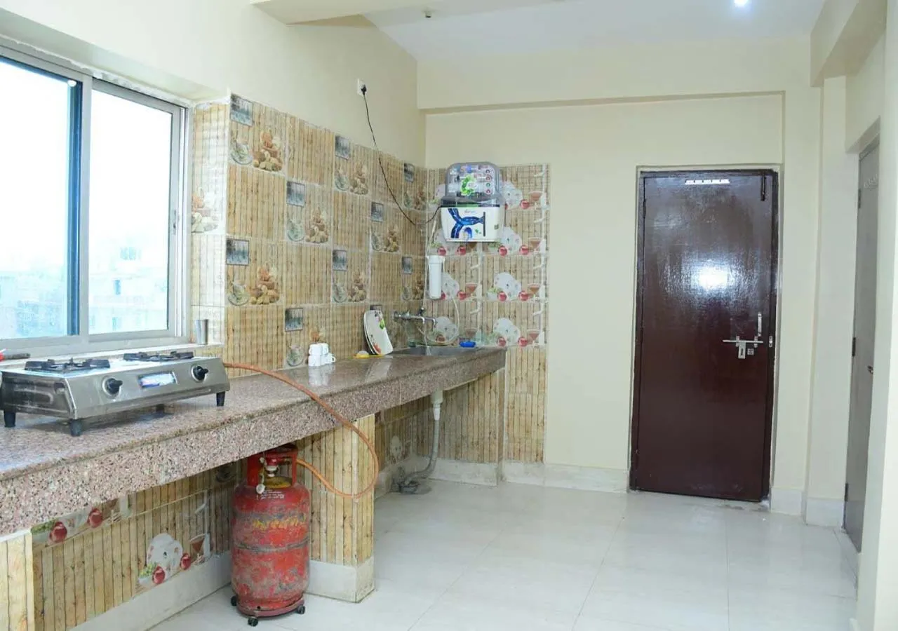 Kitchen or kitchenette in Satiya Guest House