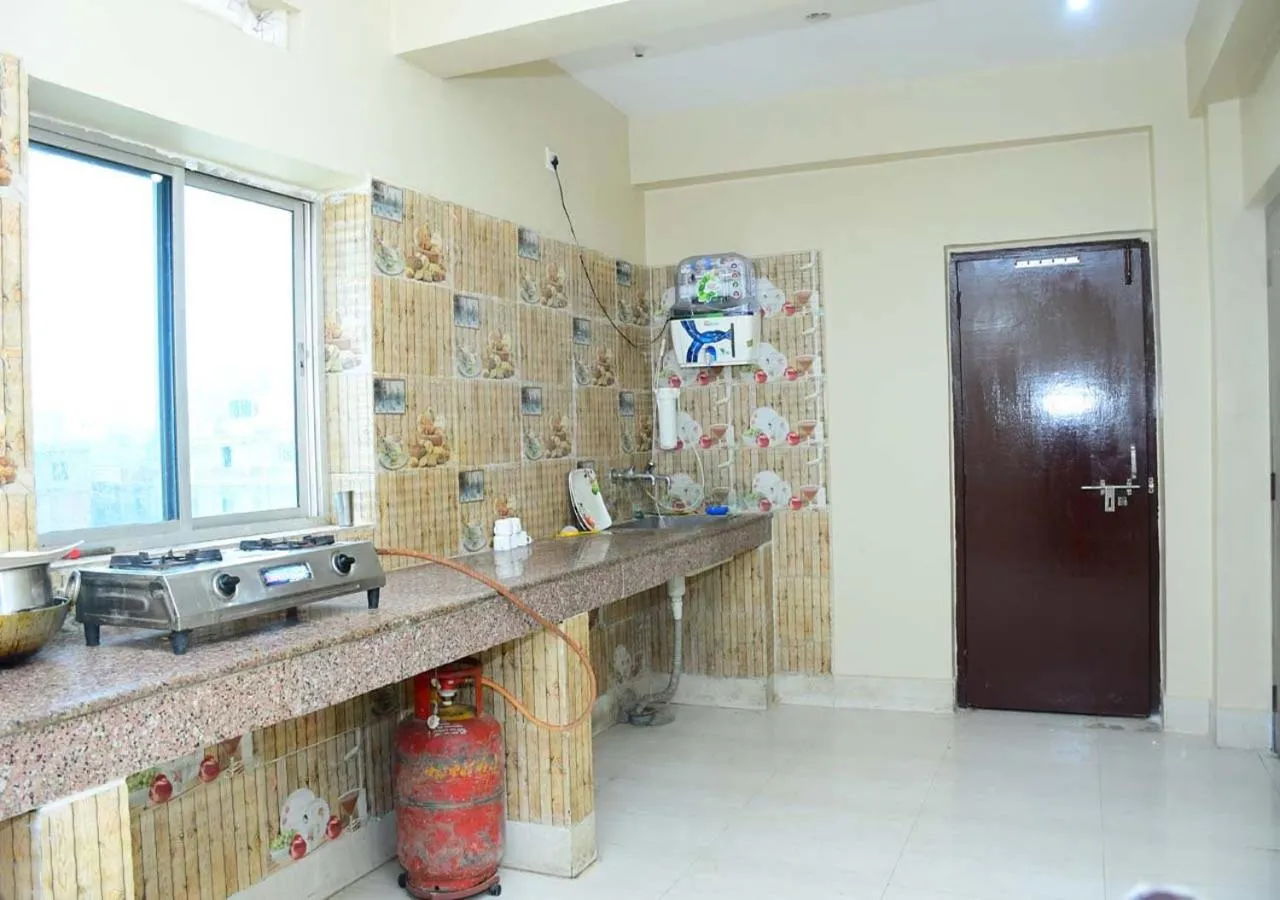Kitchen or kitchenette in Satiya Guest House