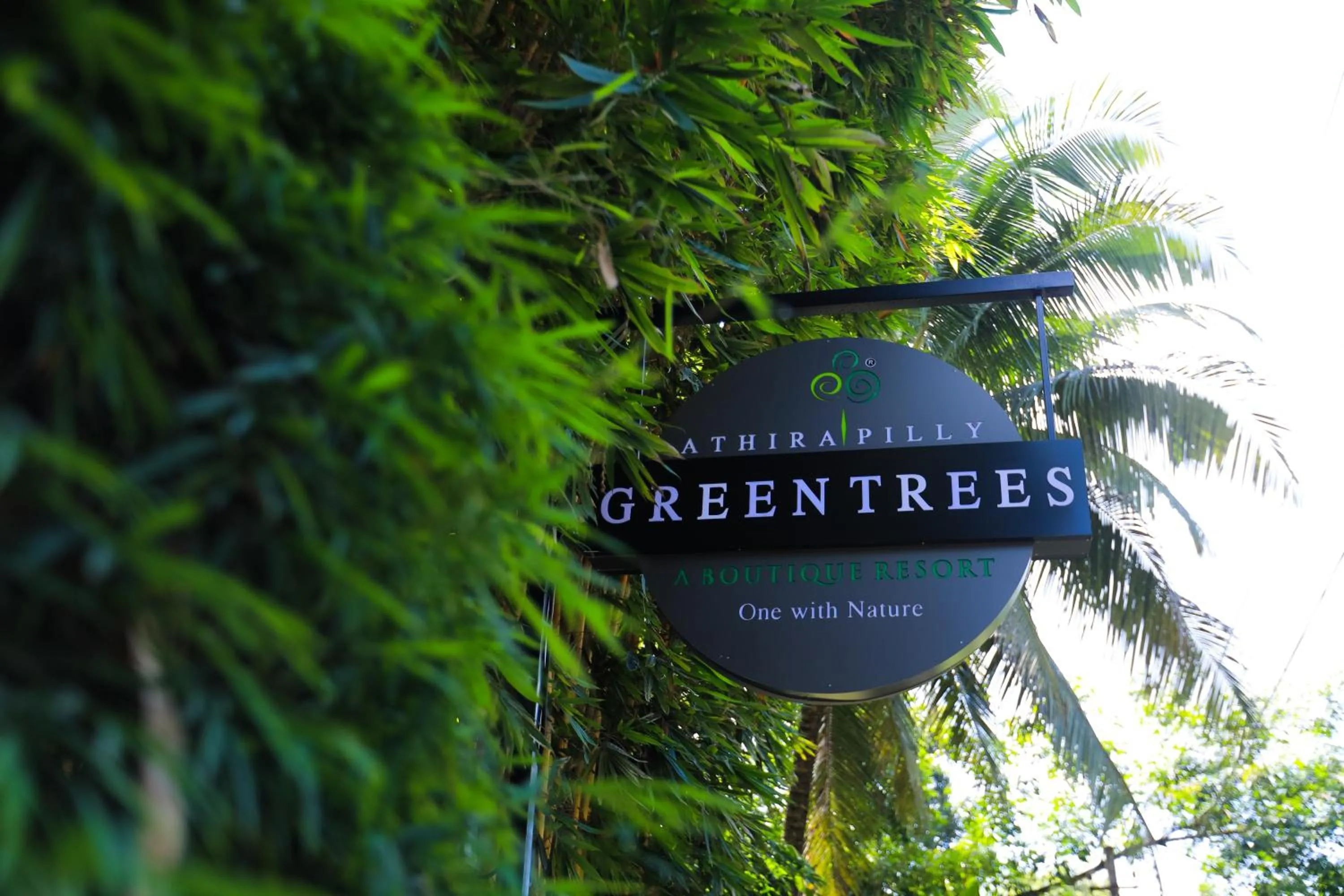 Property logo or sign in Athirapally Green Trees