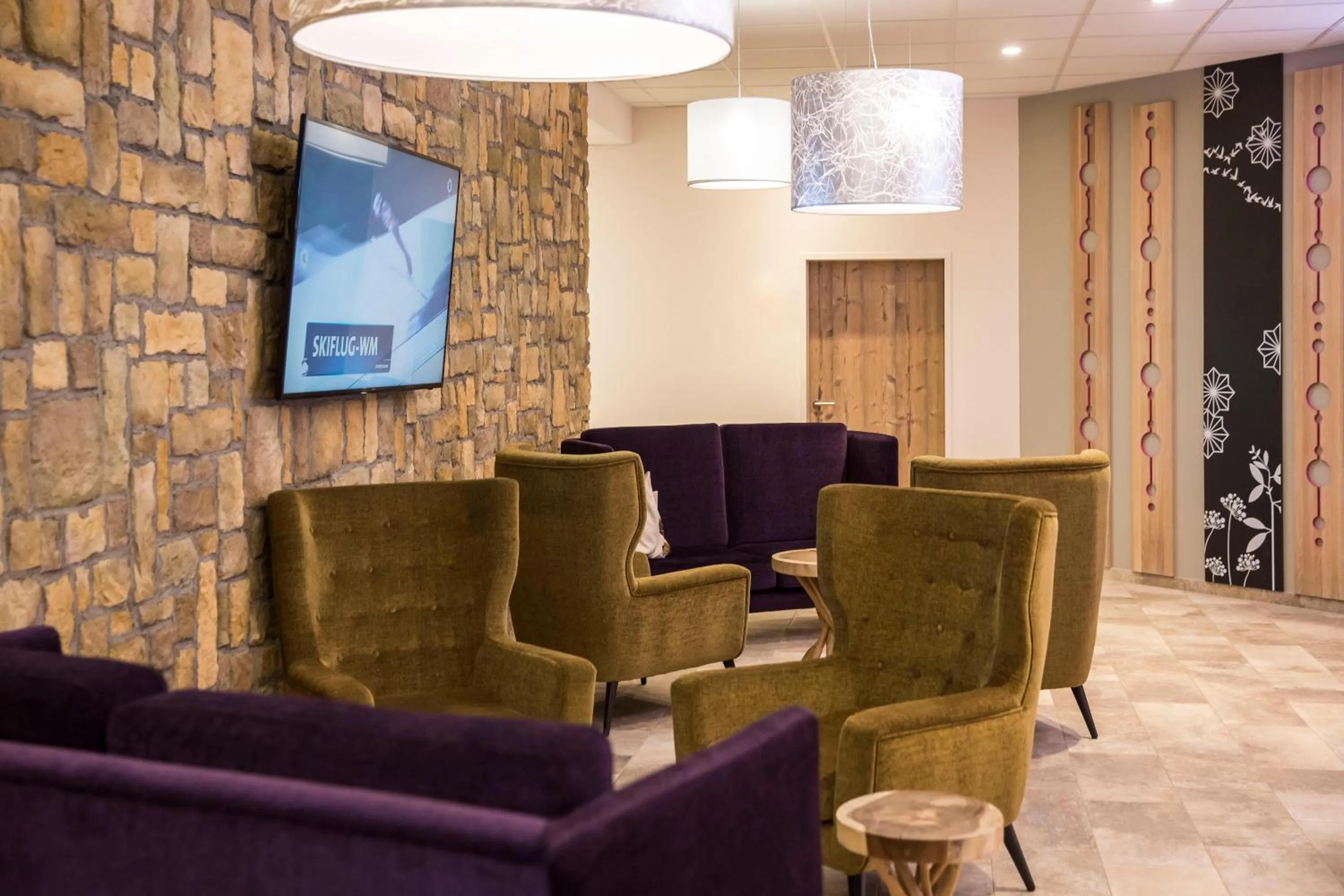 Lobby or reception in COOEE alpin Hotel Dachstein