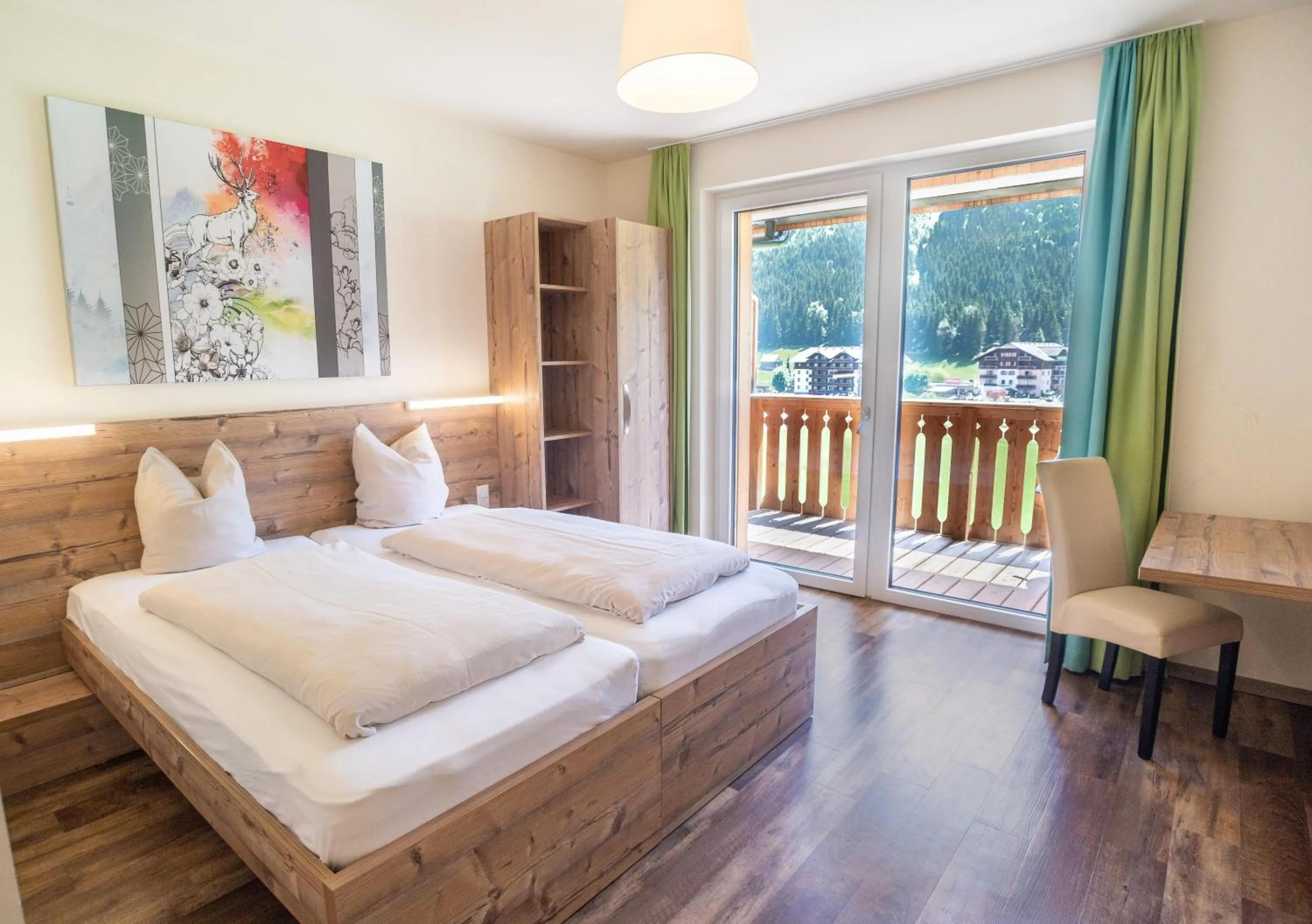 Bed in COOEE alpin Hotel Dachstein