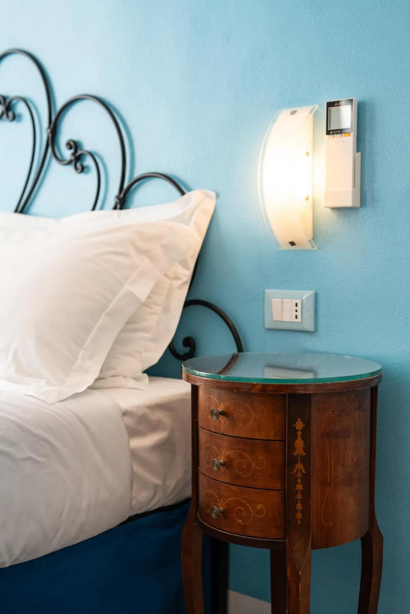 Bed in Teresa Rooms & Suites