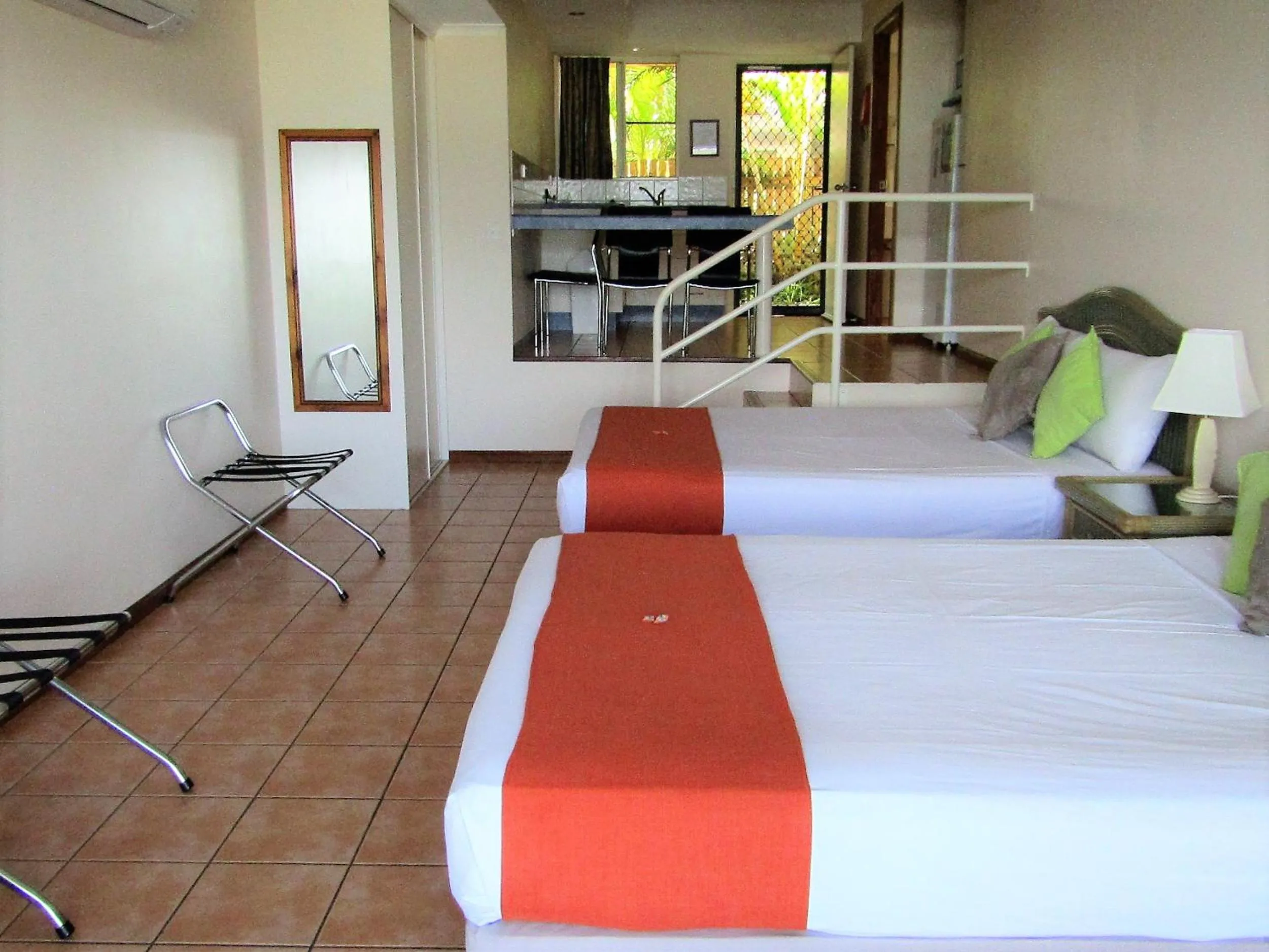 Bed in Sunlit Waters Studio Apartments