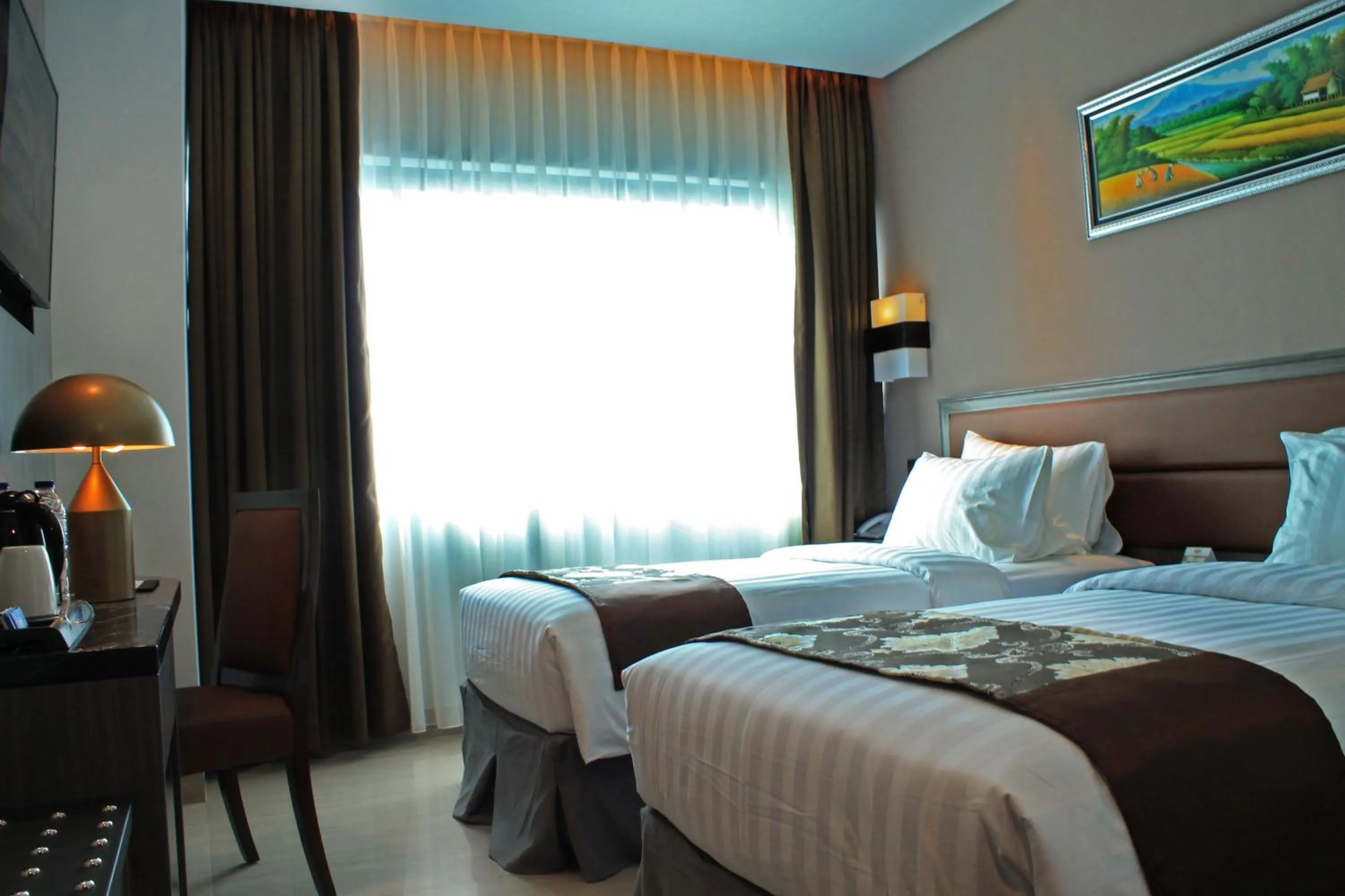 Bed in Arthama Hotels Makassar
