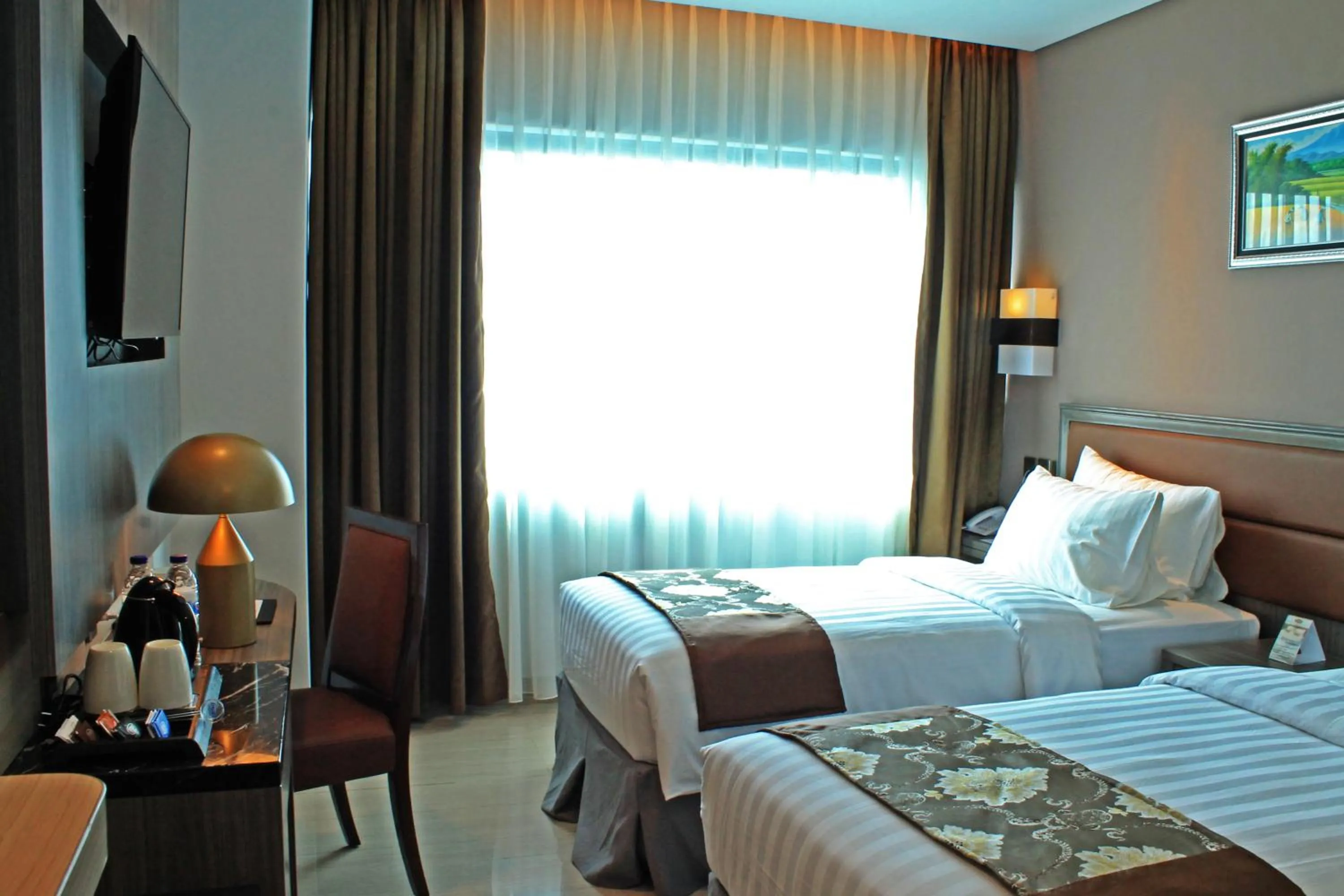 Photo of the whole room, Bed in Arthama Hotels Makassar