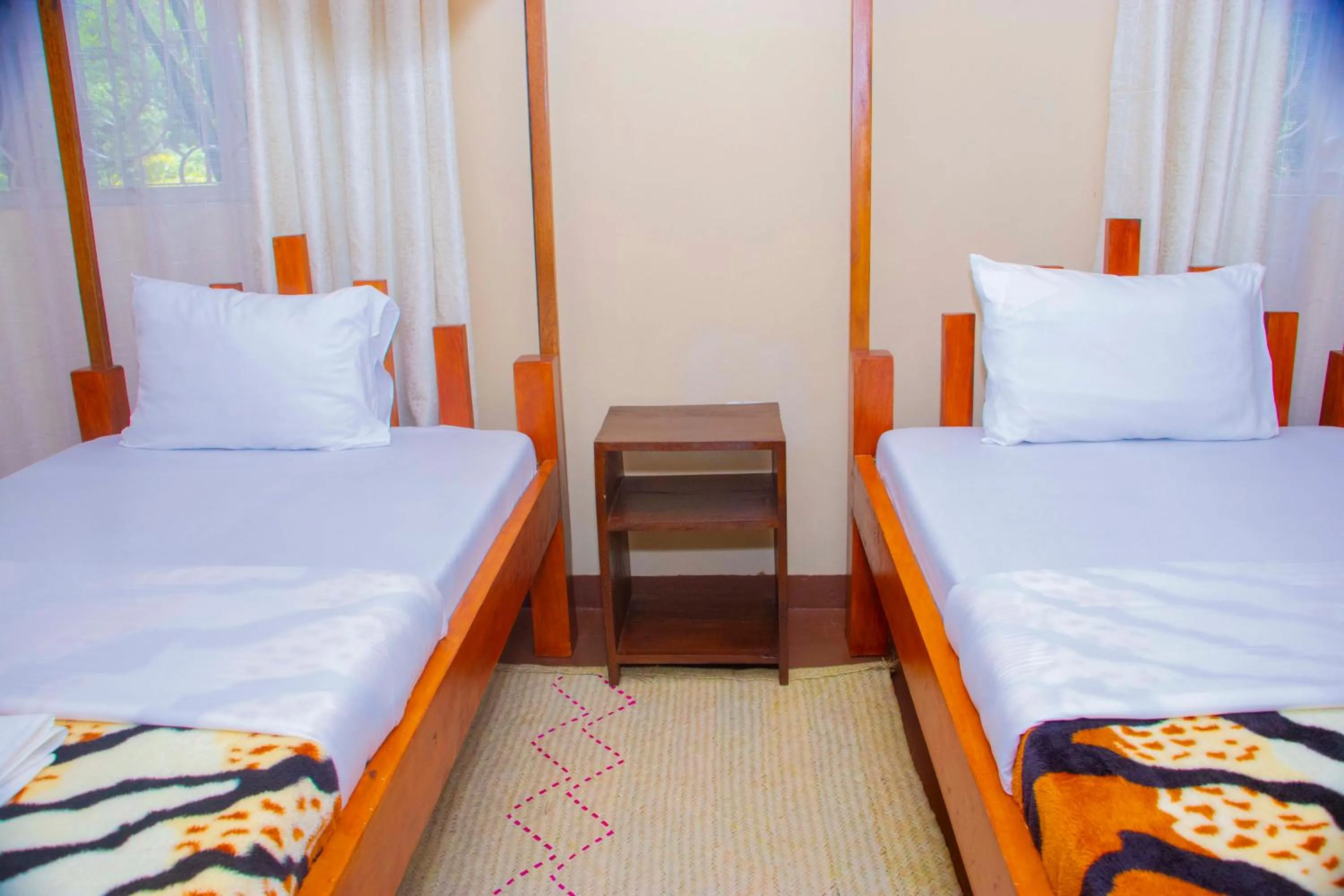 Bed in Endasawa Tree Lodge