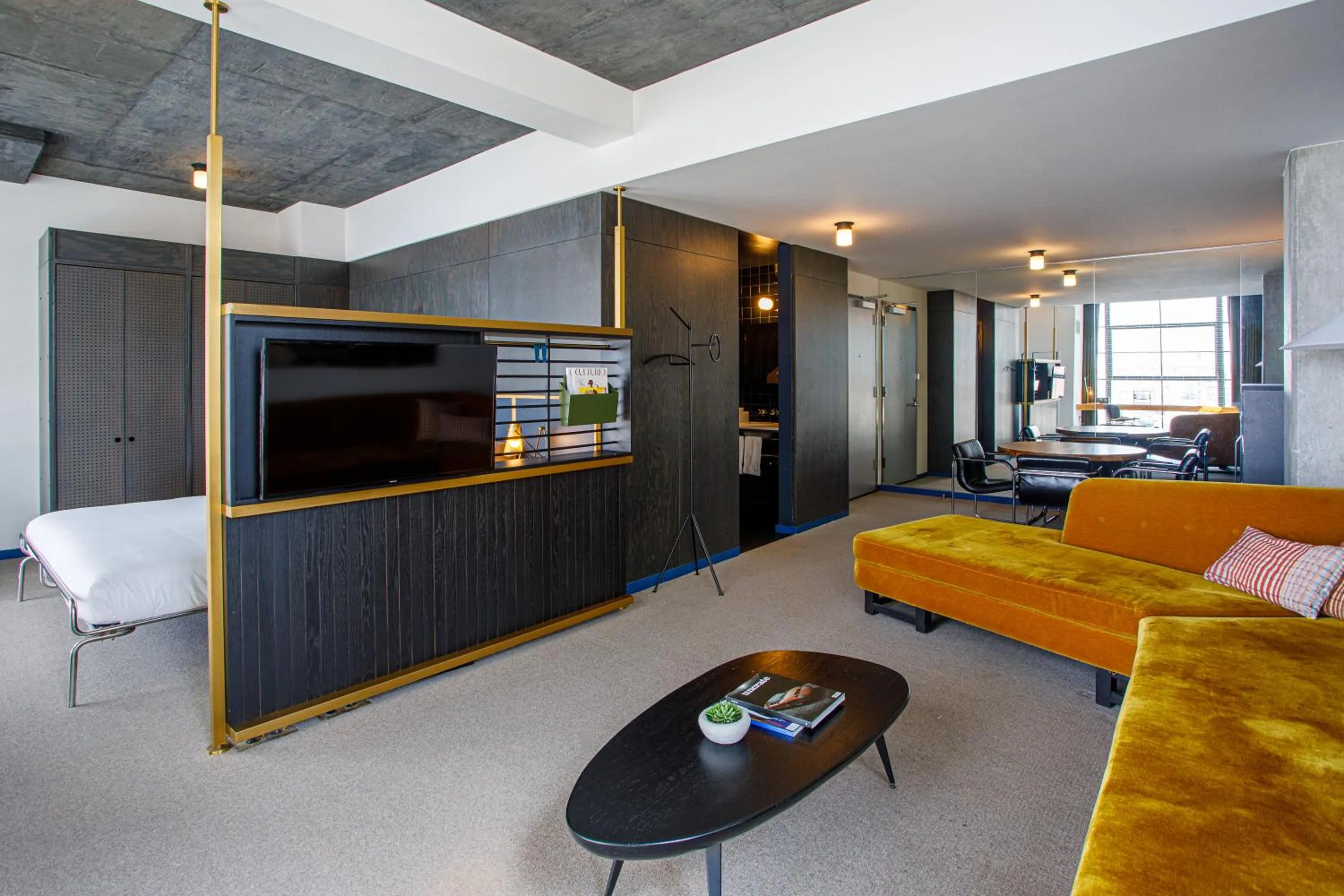 Communal lounge/ TV room in The Emily Hotel