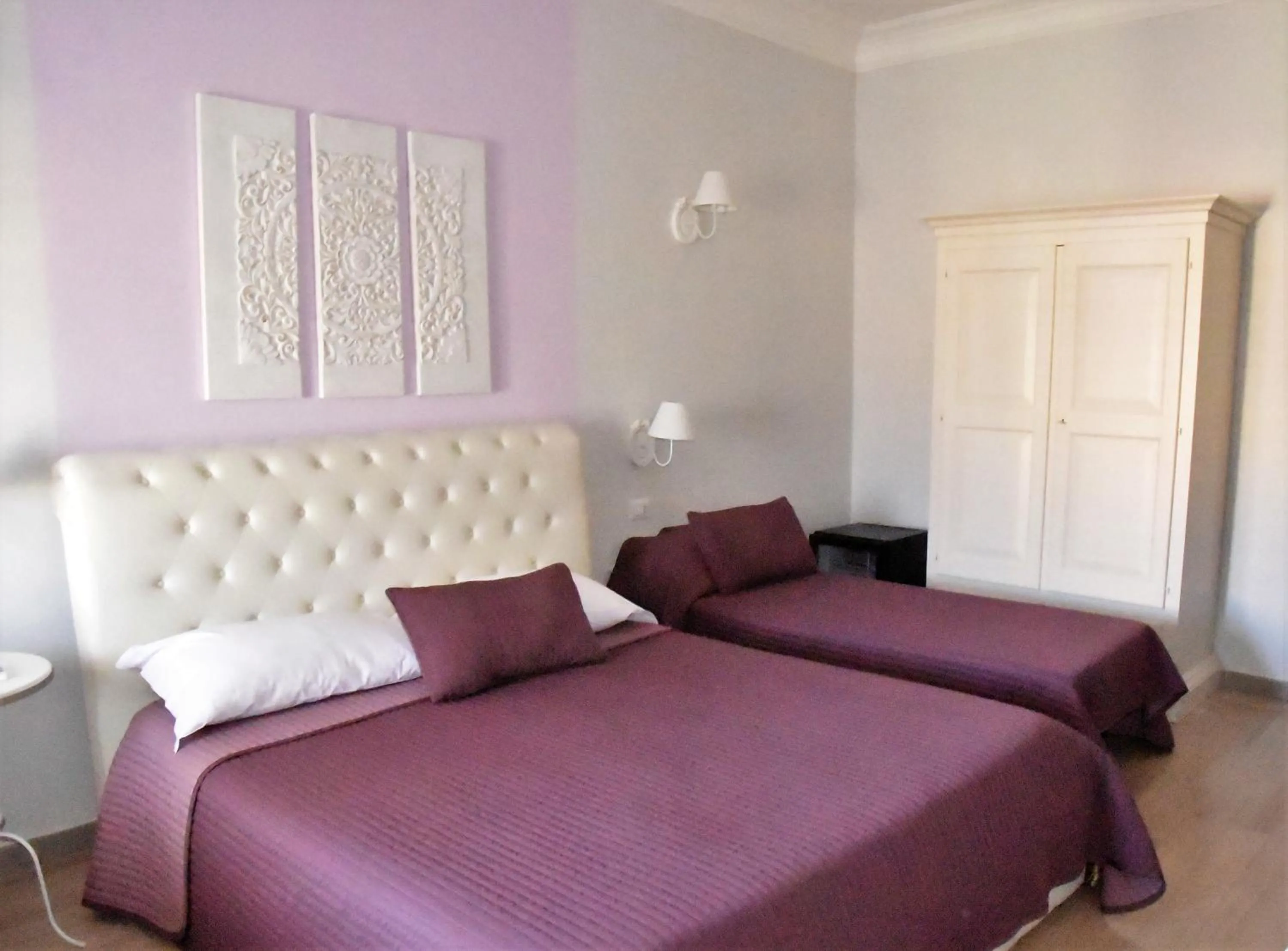 Quadruple Room with Balcony in Simonetta's Rooms
