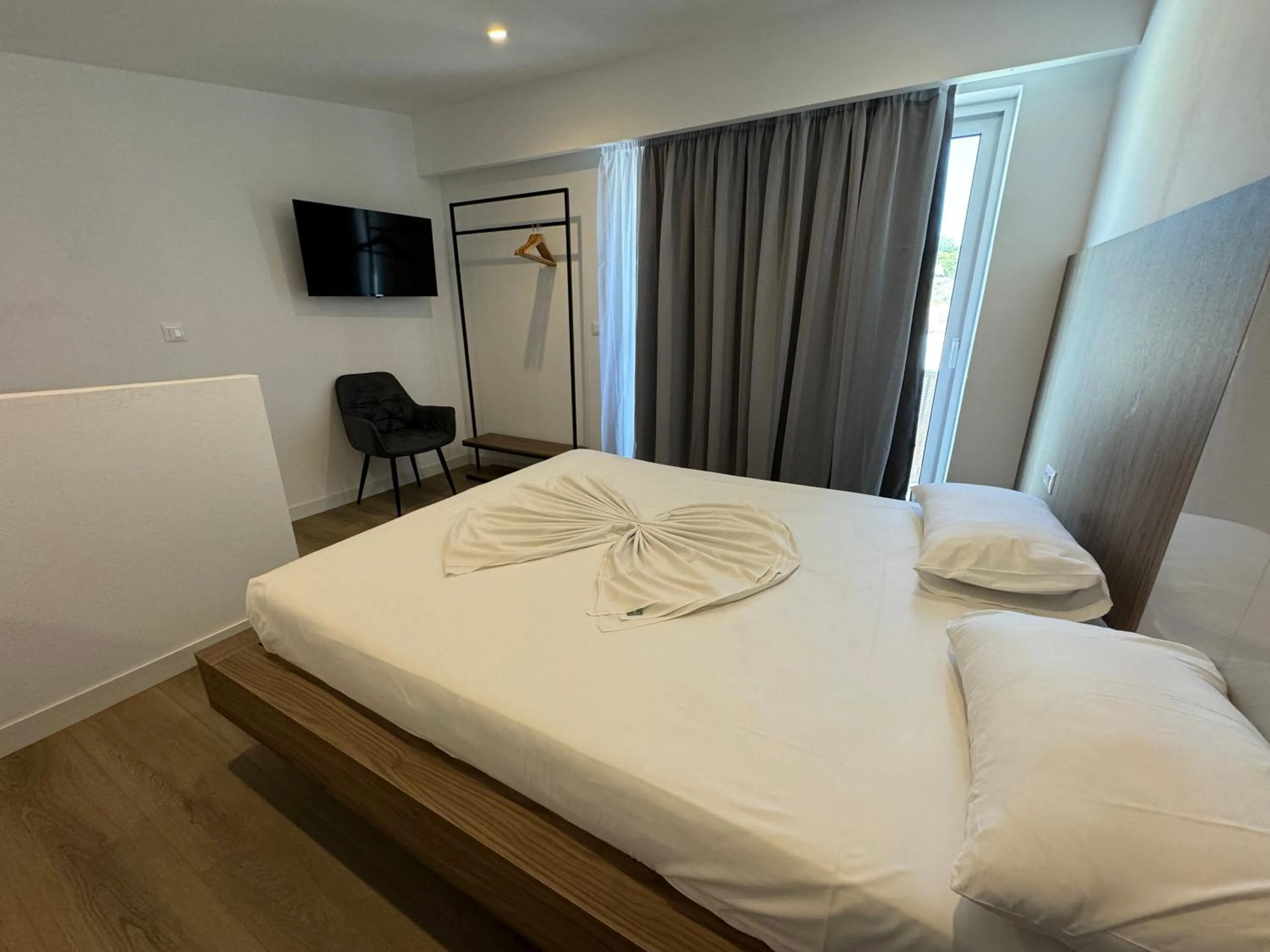 Bedroom, Bed in Delfinia Resort - All Inclusive