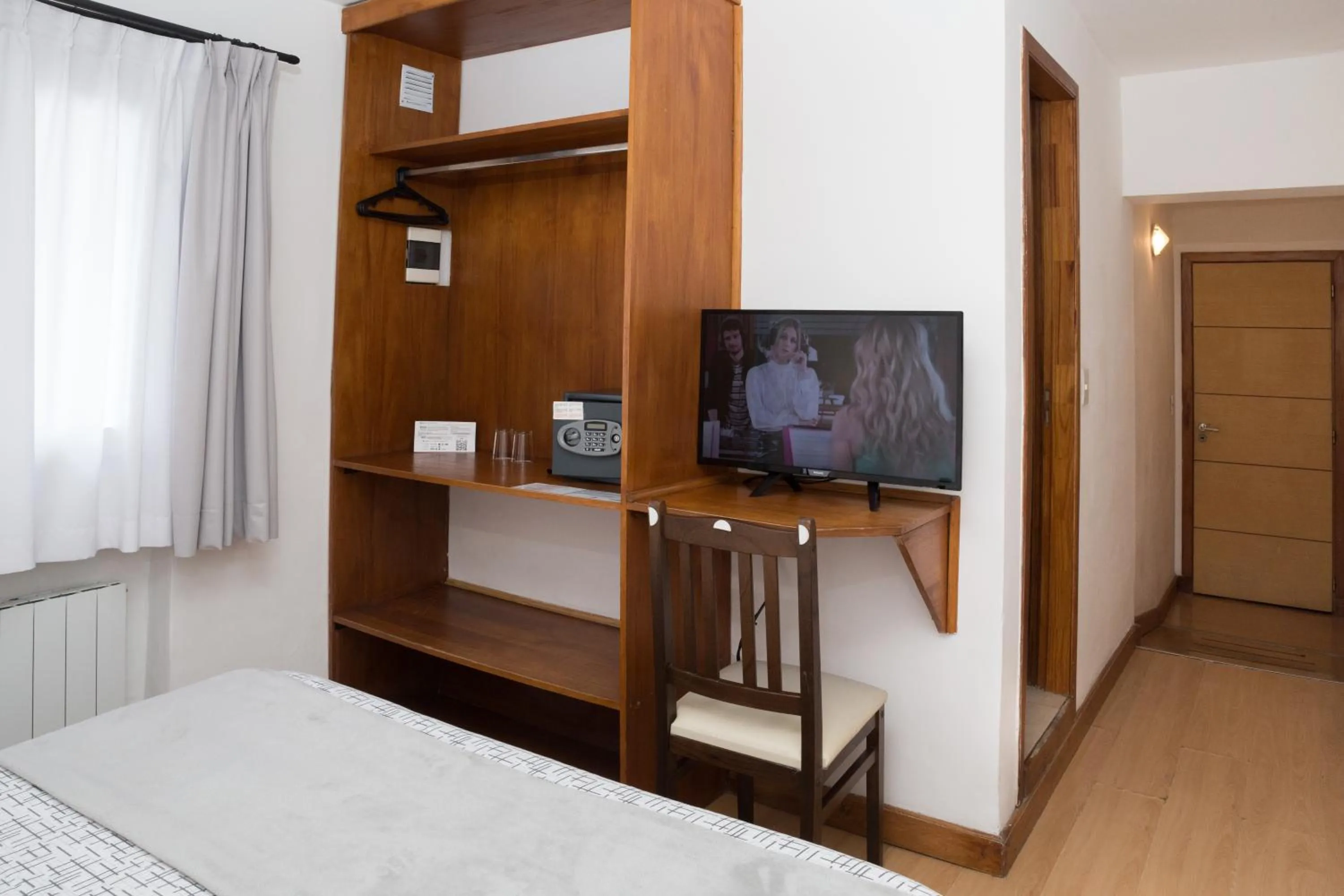 Bed in NBH Premier Hotel