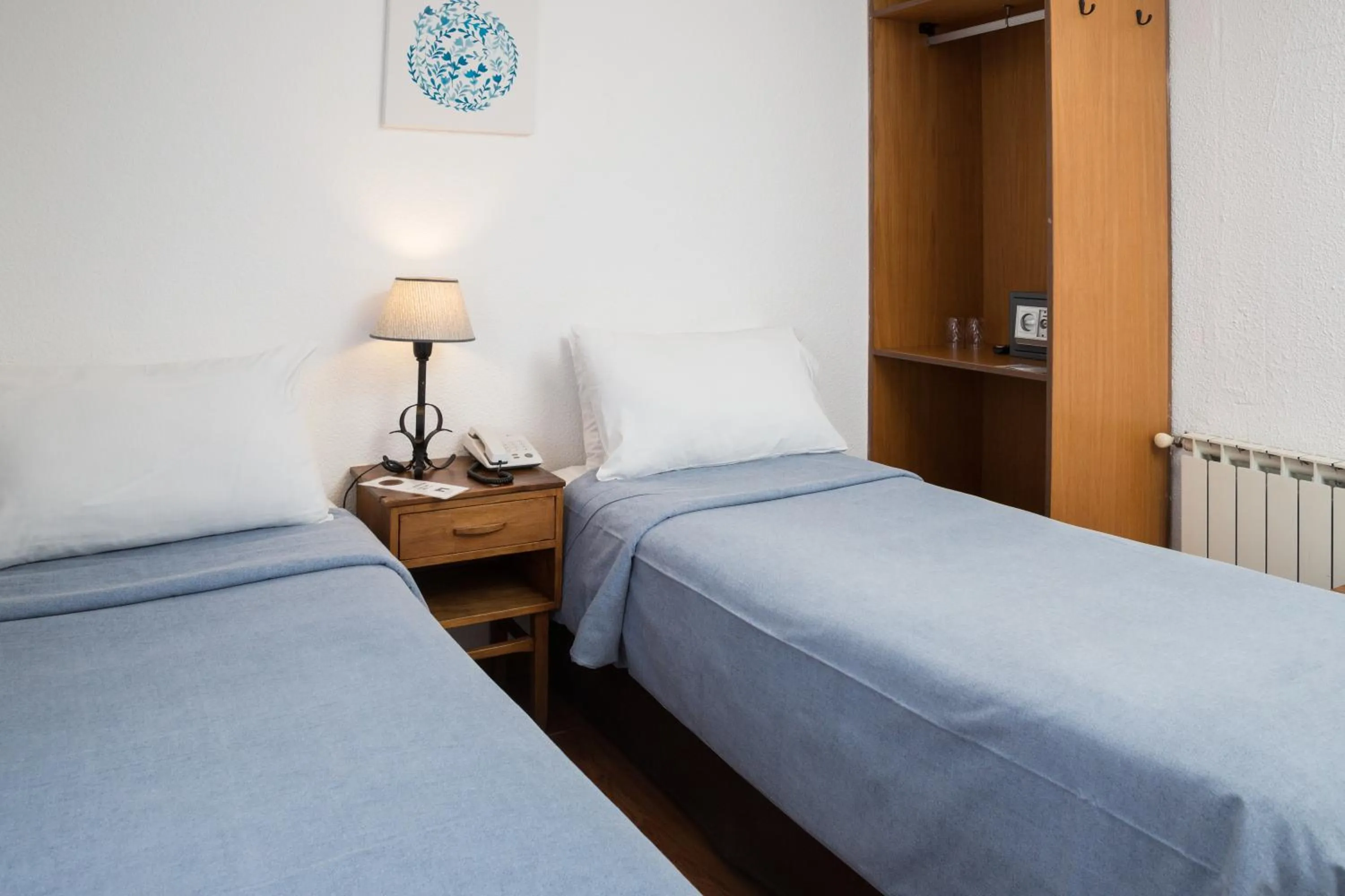 Bed in NBH Premier Hotel