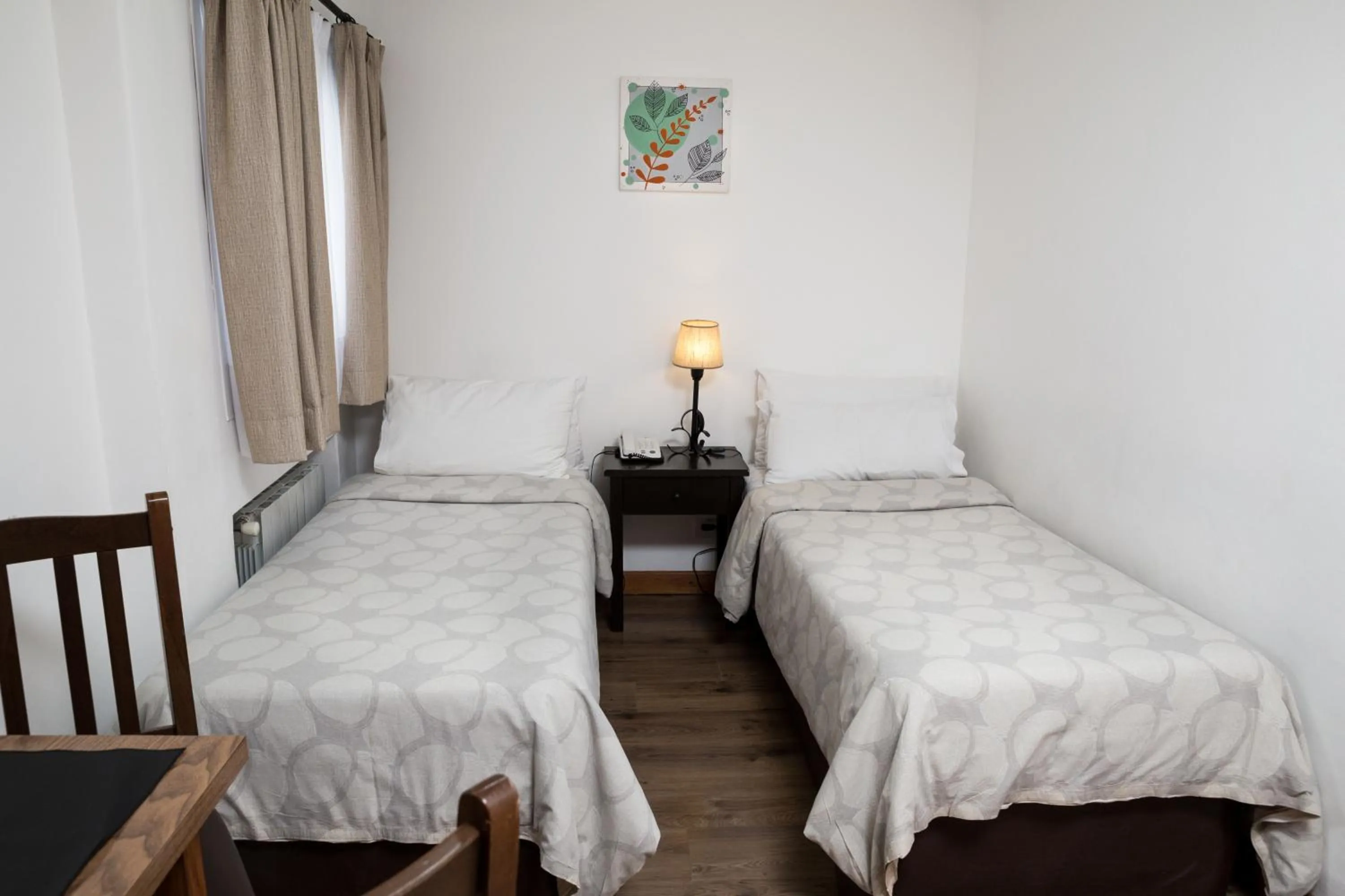 Bed in NBH Premier Hotel