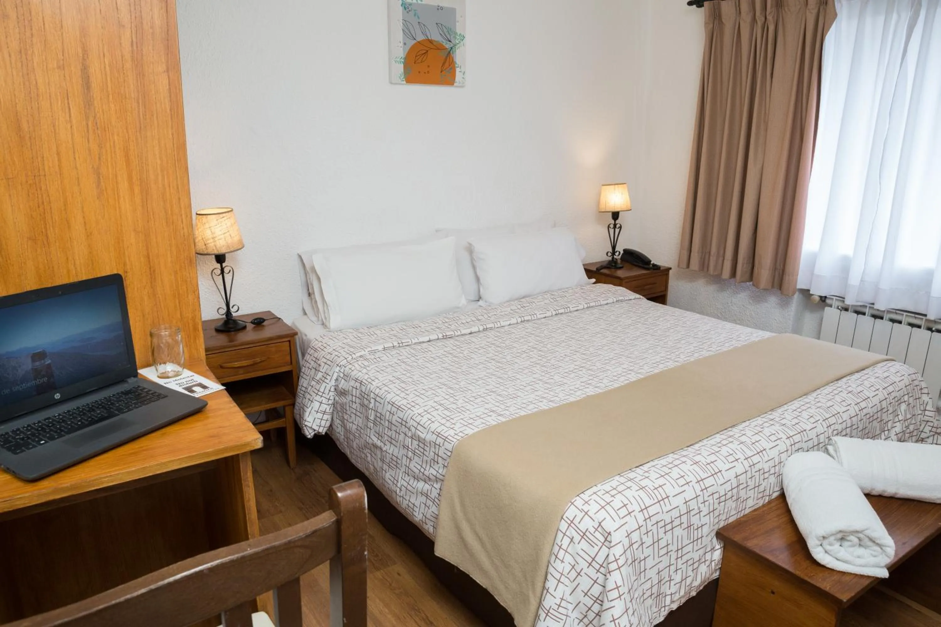 Bed in NBH Premier Hotel