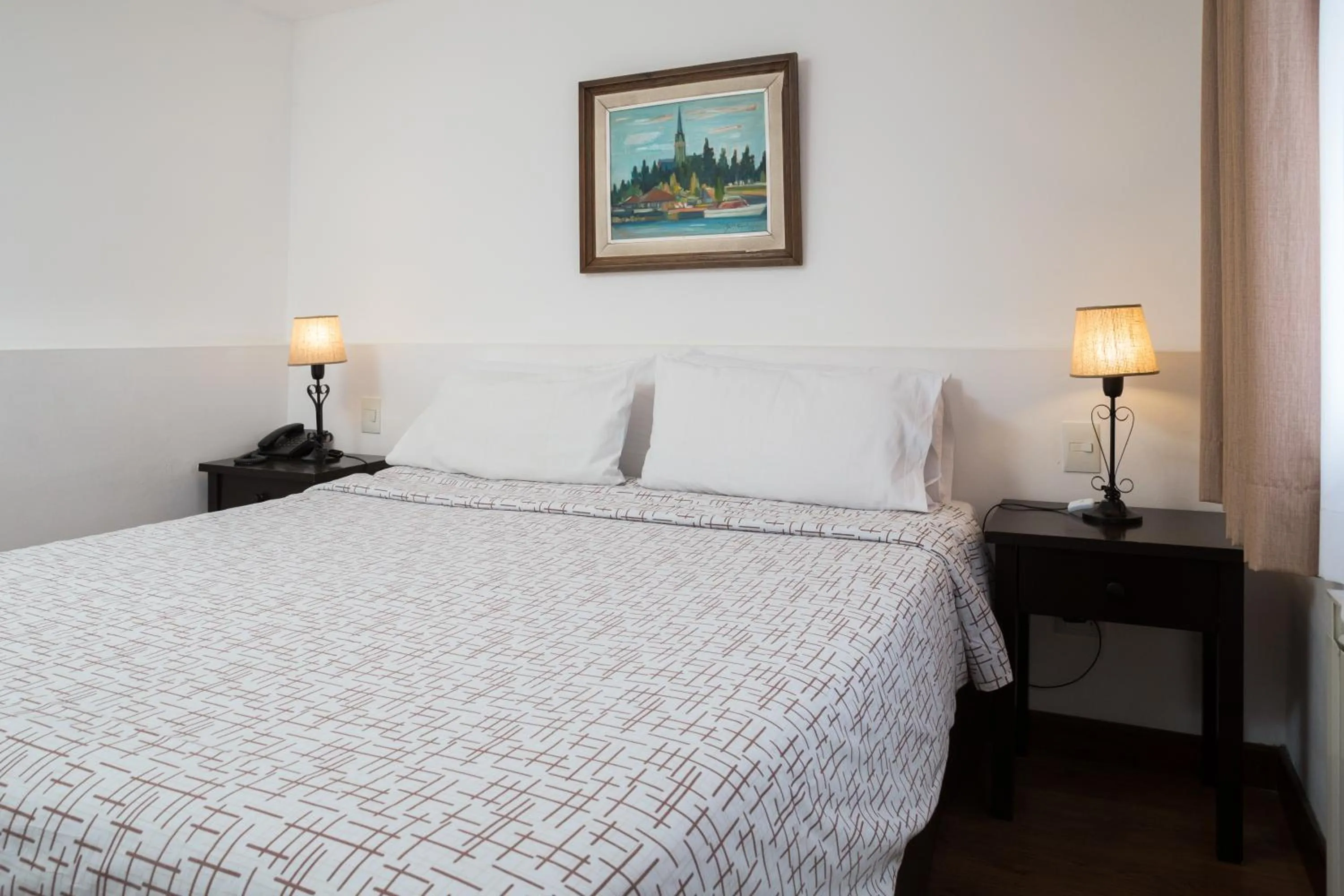 Bed in NBH Premier Hotel