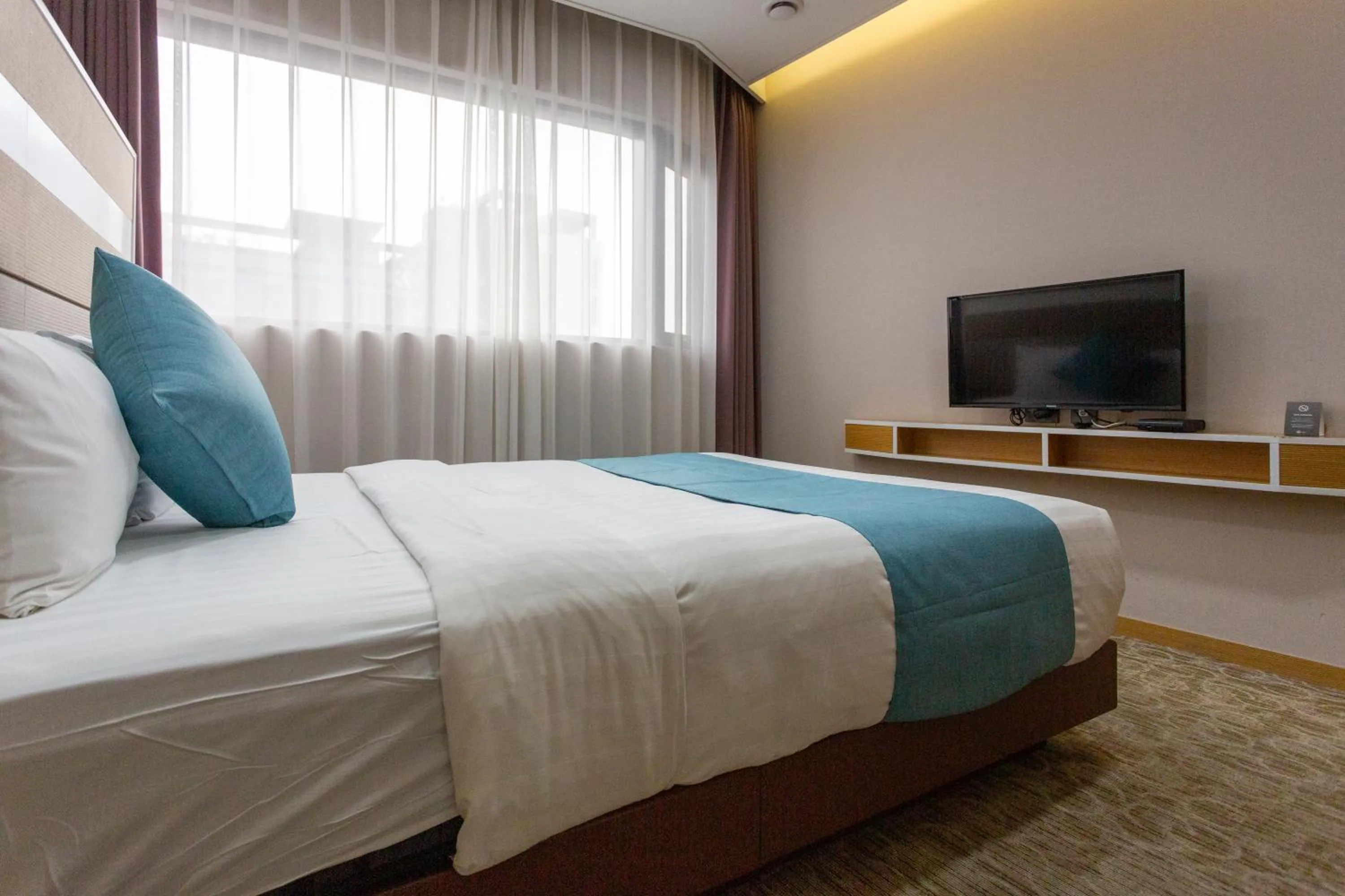 Bed in The Recenz Dongdaemun Hotel